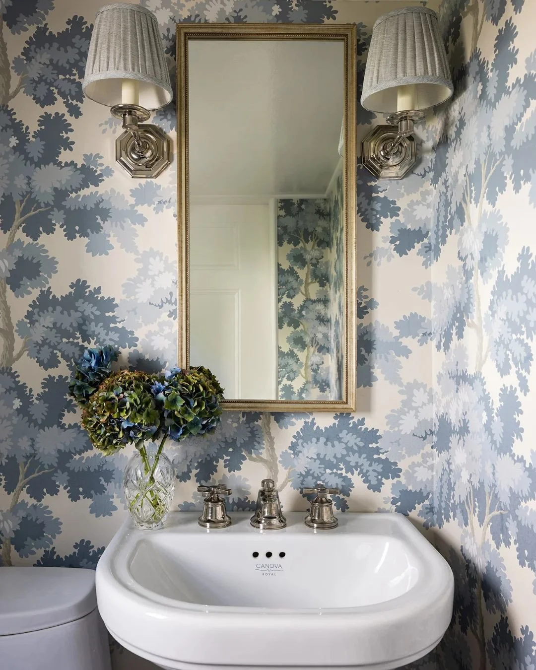Sometimes all it takes is one bold decision.⁠
⁠
In this case, it was wrapping the entire powder room in a beautiful wallpaper, transforming a purely functional space into one with charm, character, and lasting impact.⁠
⁠
Swipe for the before.