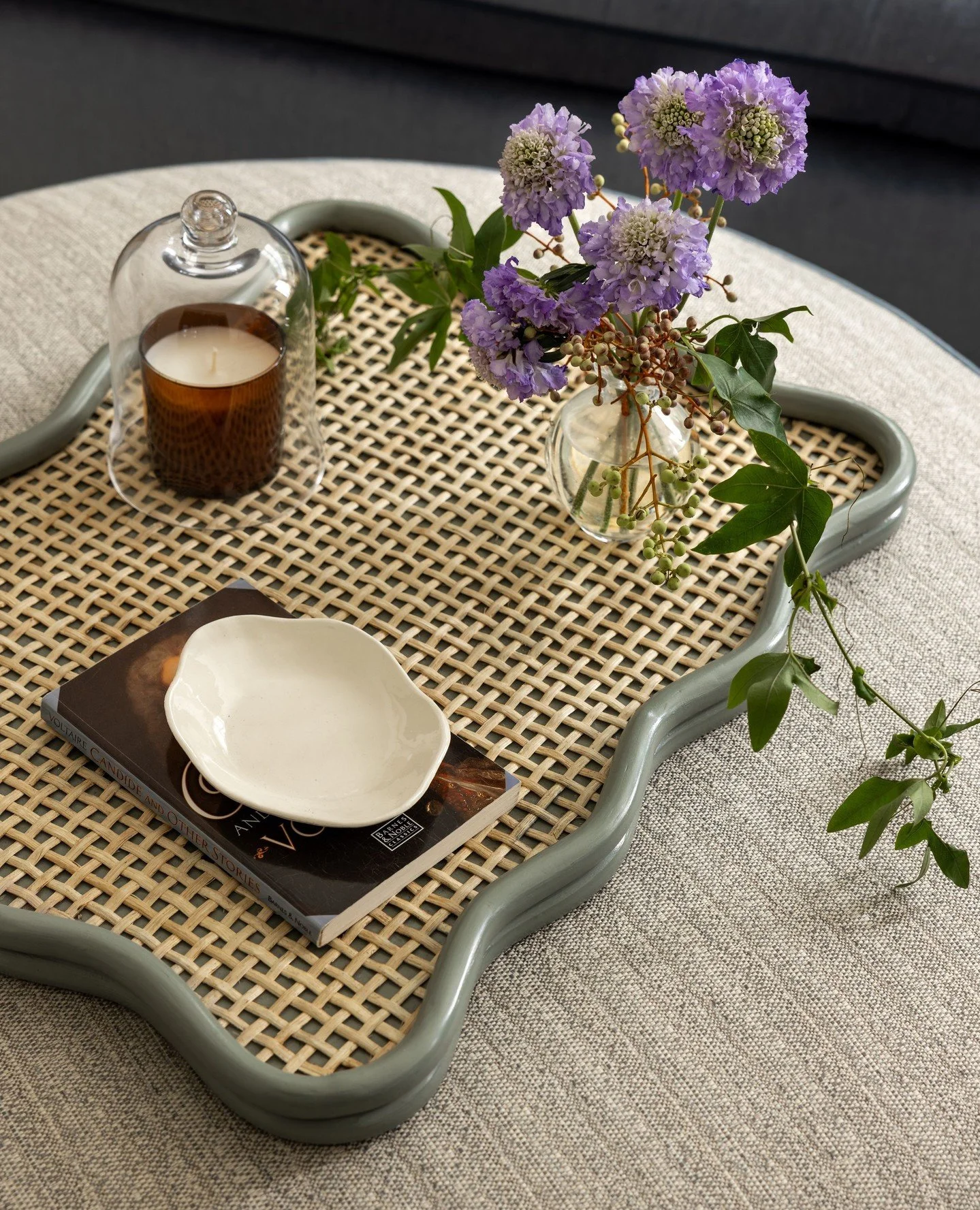 Vignettes from Cherry Street.⁠
⁠
I love the idea of a beautiful tray atop an ottoman&mdash;an elegant, versatile alternative to a traditional coffee table.⁠
⁠
The perfect place for fresh flowers, a favorite book, the remotes, and a bowl of popcorn fo