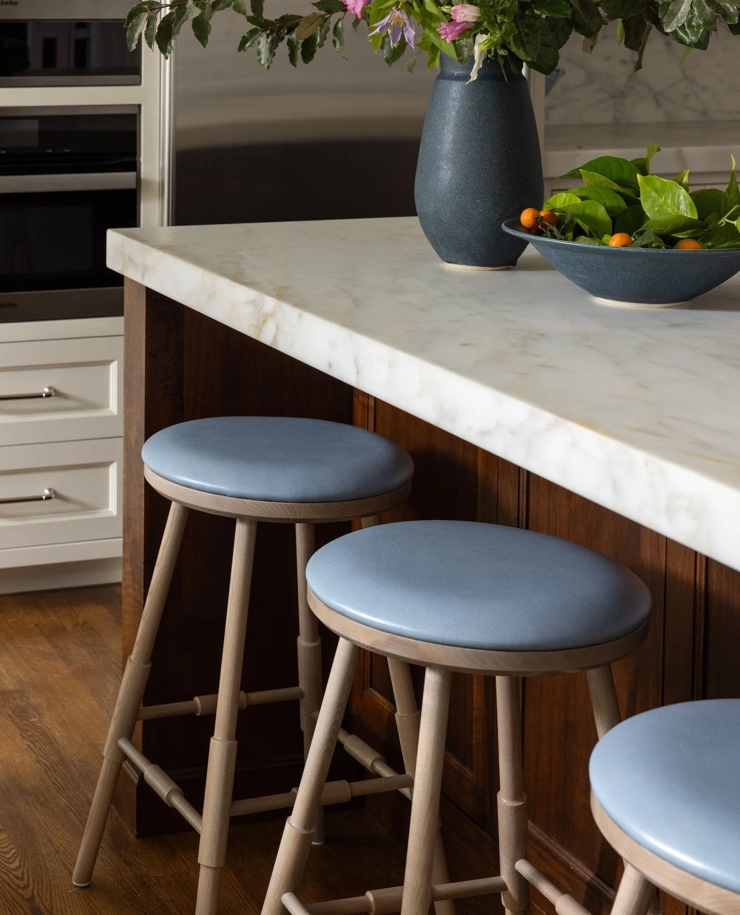 Statement stools.⁠
⁠
A little blue, a lot of personality. These beautifully understated stools bring just the right amount of color and character to the kitchen at Cherry Street.⁠
⁠
Stools by: @oandgstudio
