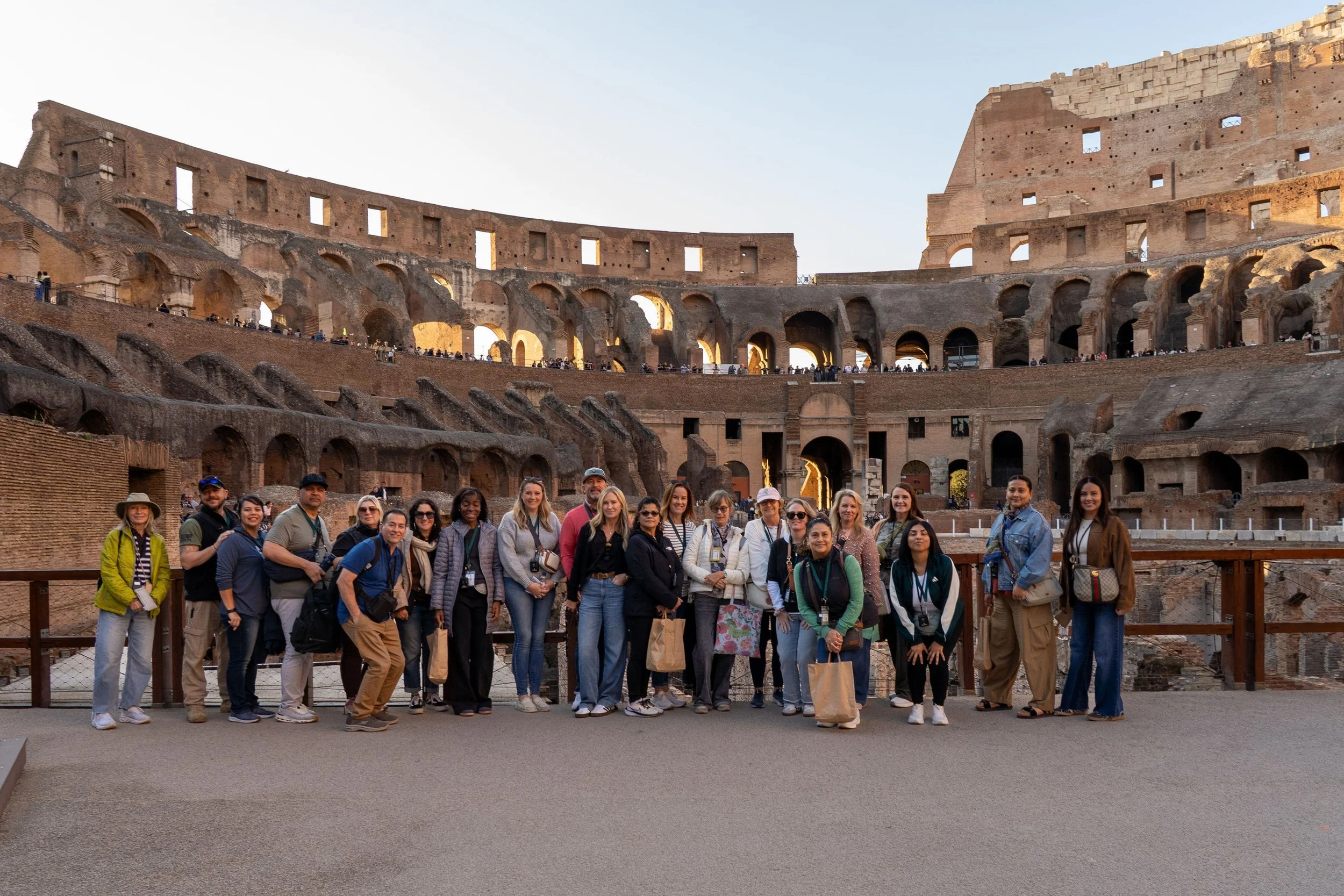 A Bible Study Live travel group standing together inside the Colosseum in Rome