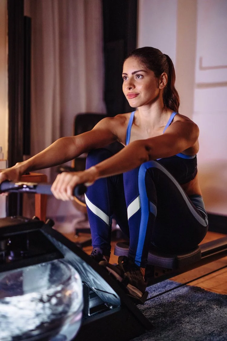 Woman on rower in living room