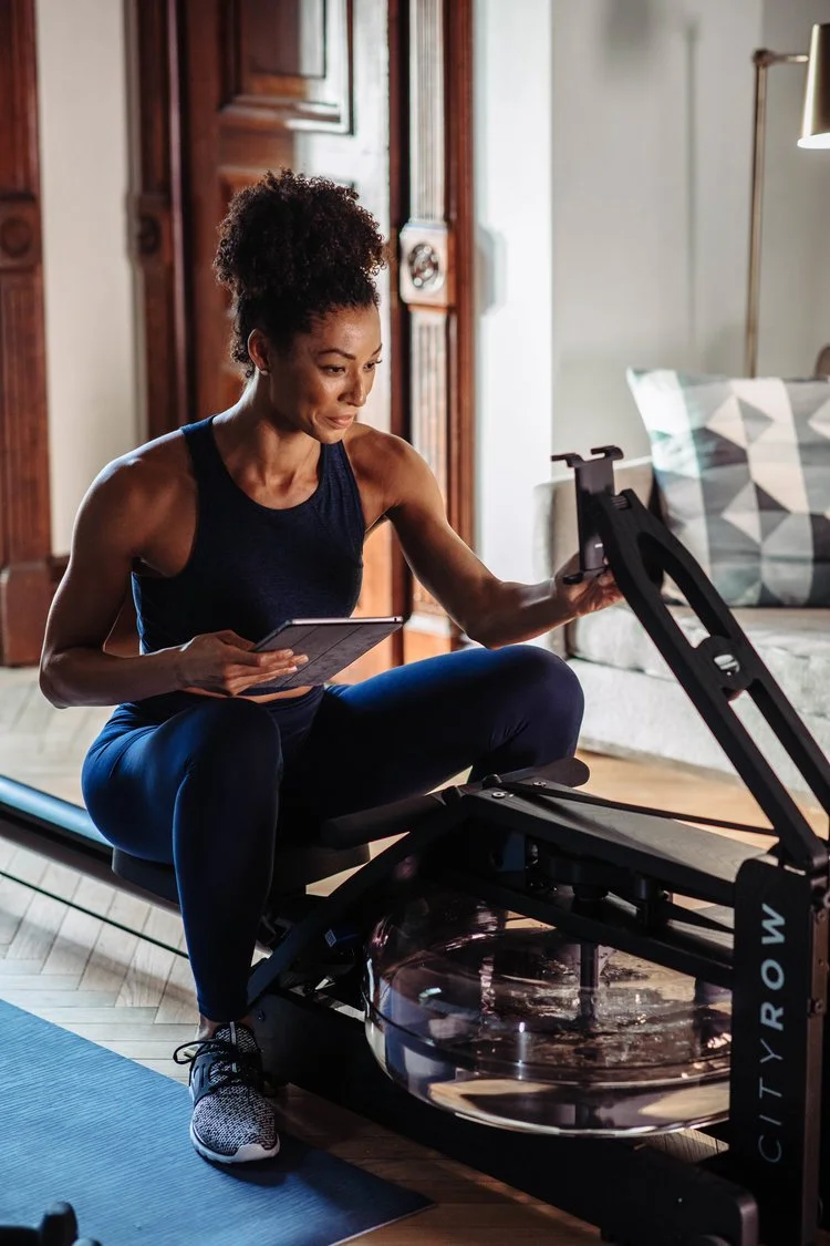 Woman on rower in living room