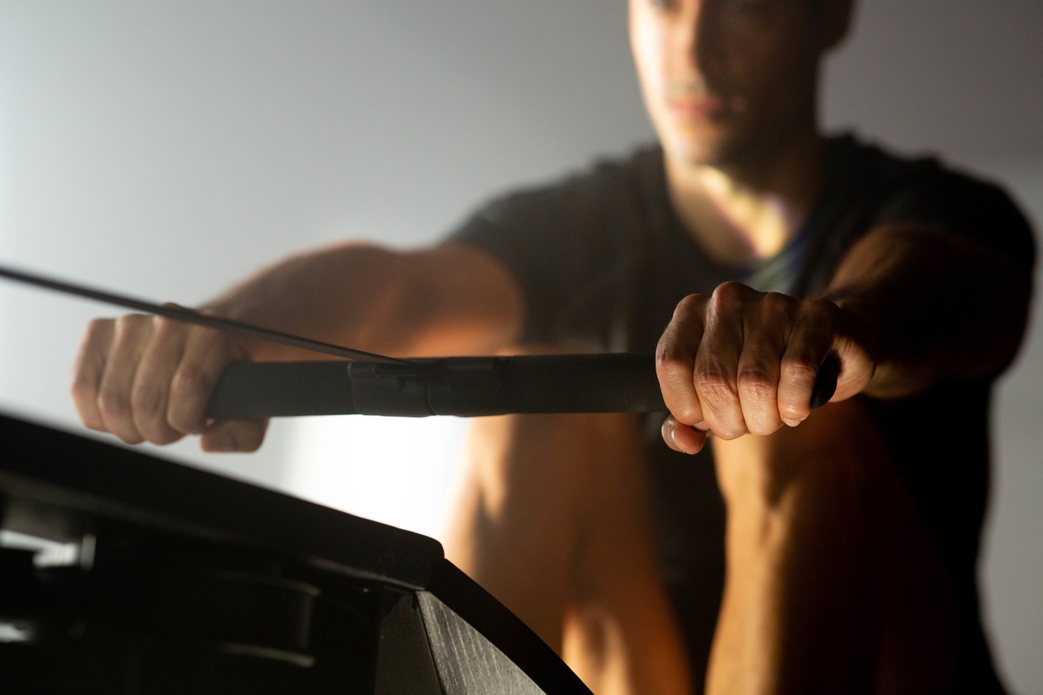 Close up of male hands on rower