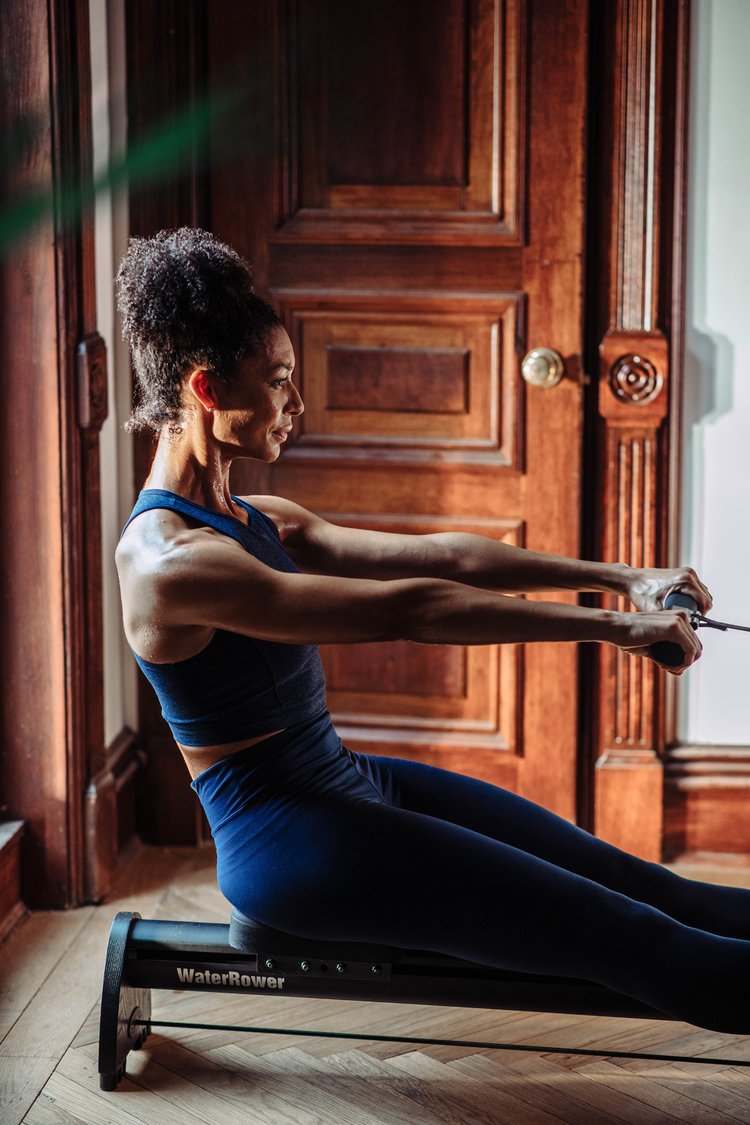 Woman on rower in living room