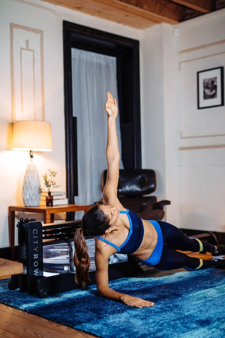 Woman on rower in living room