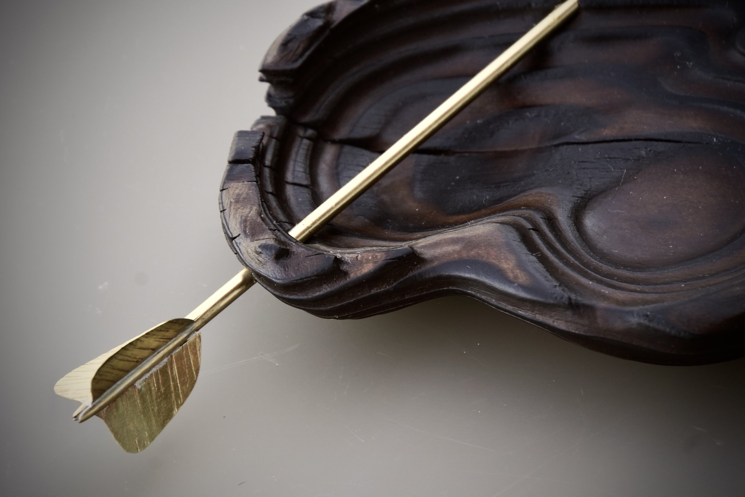 Detail: Cupid was here! Solid brass, lacquered.
