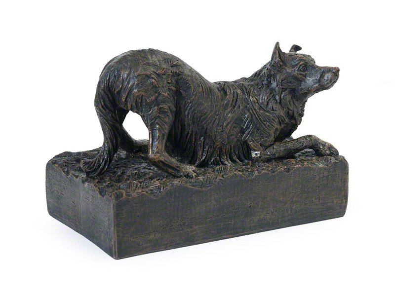 cast resin Border Collie figurine urn, with a bronze finish, depicting a crouching canine with detailed fur, resting on a textured ashes holding base.
