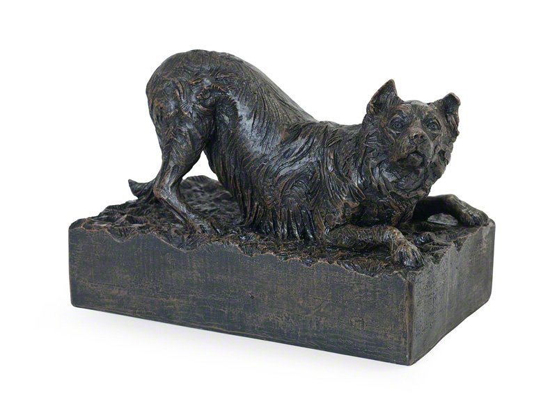 cast resin Border Collie figurine urn, with a bronze finish, depicting a crouching canine with detailed fur, resting on a textured ashes holding base.
