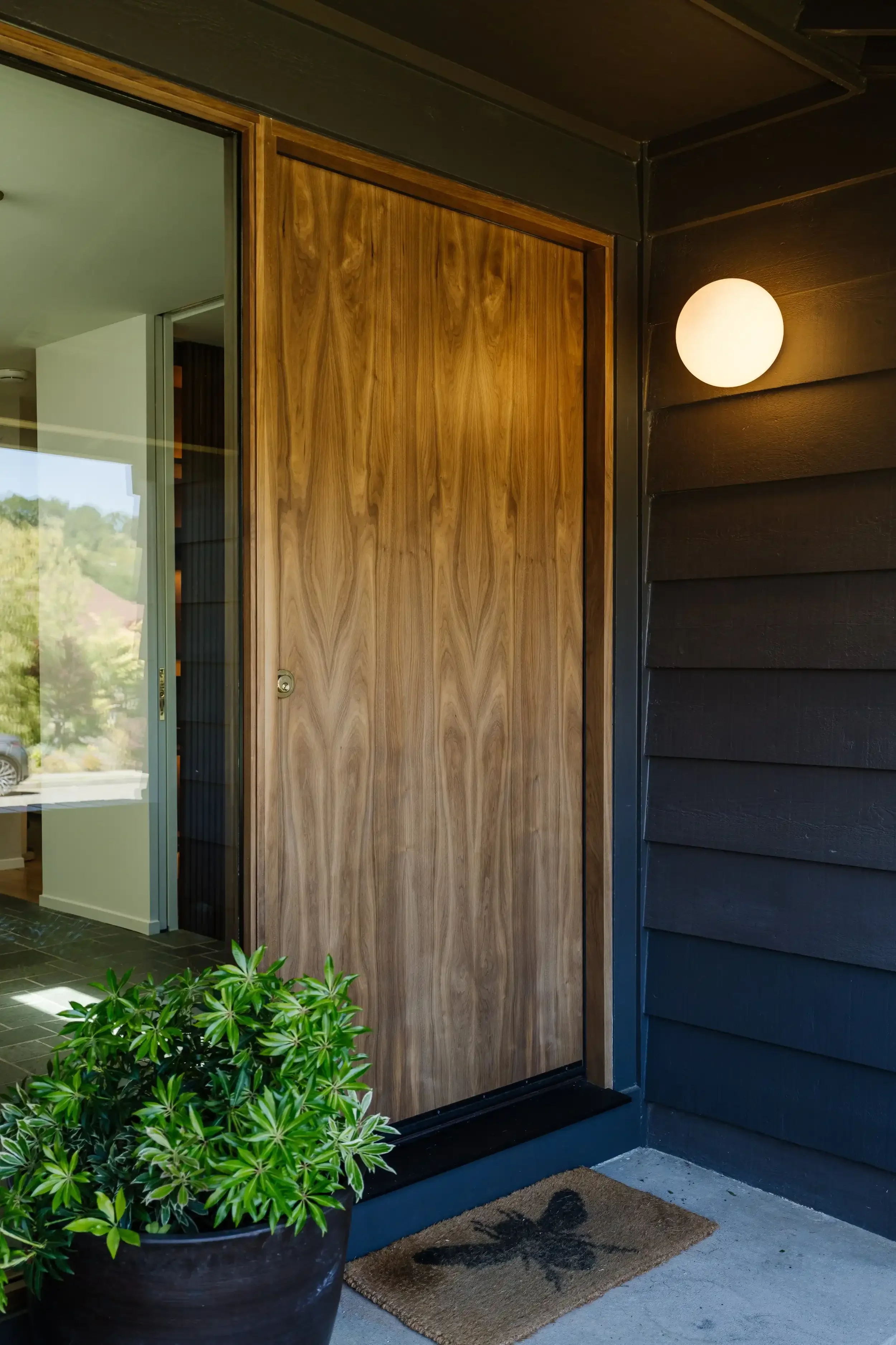 a-small-room-with-a-door-and-a-small-window.webp