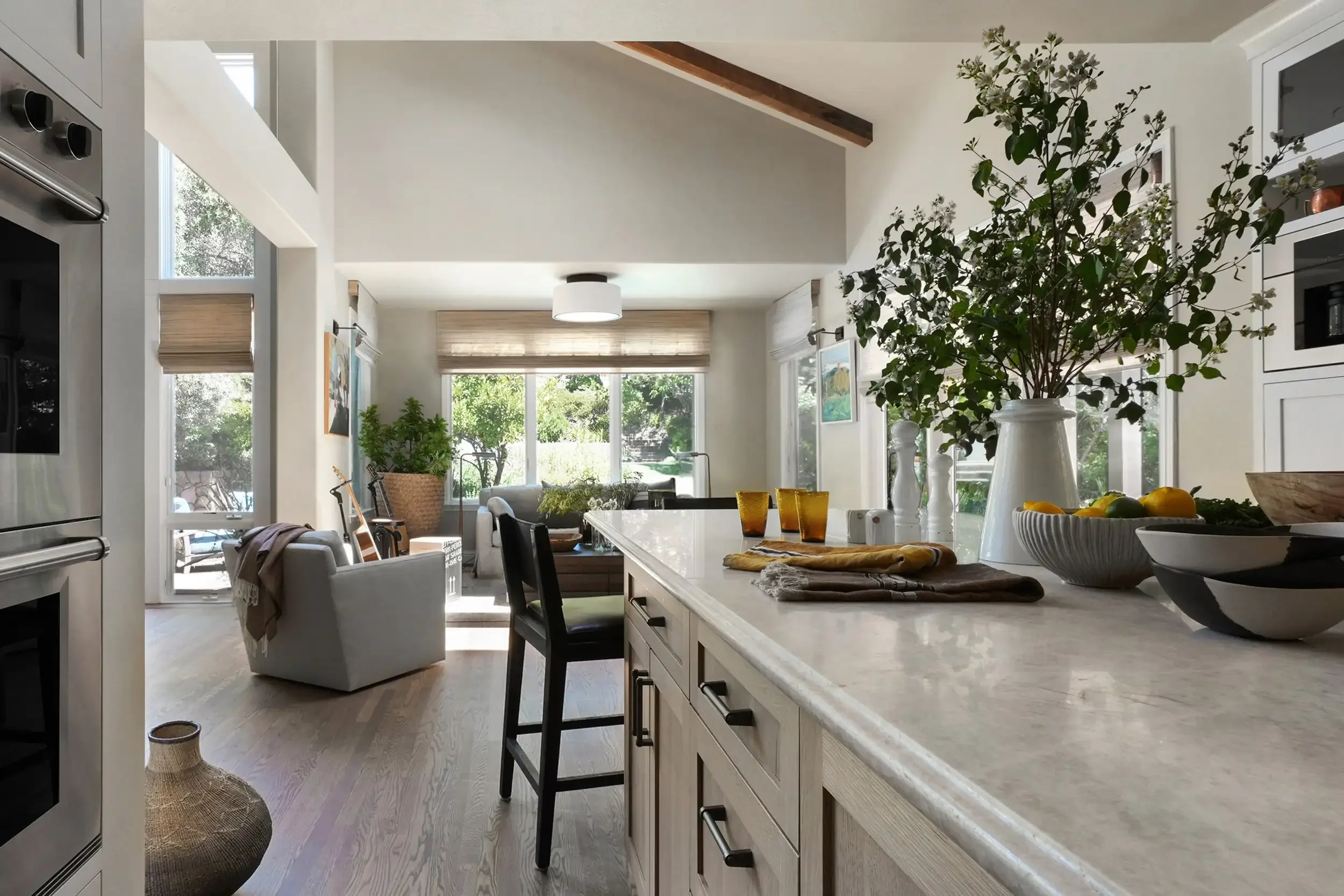 a-kitchen-with-a-large-island-and-a-large-window.webp
