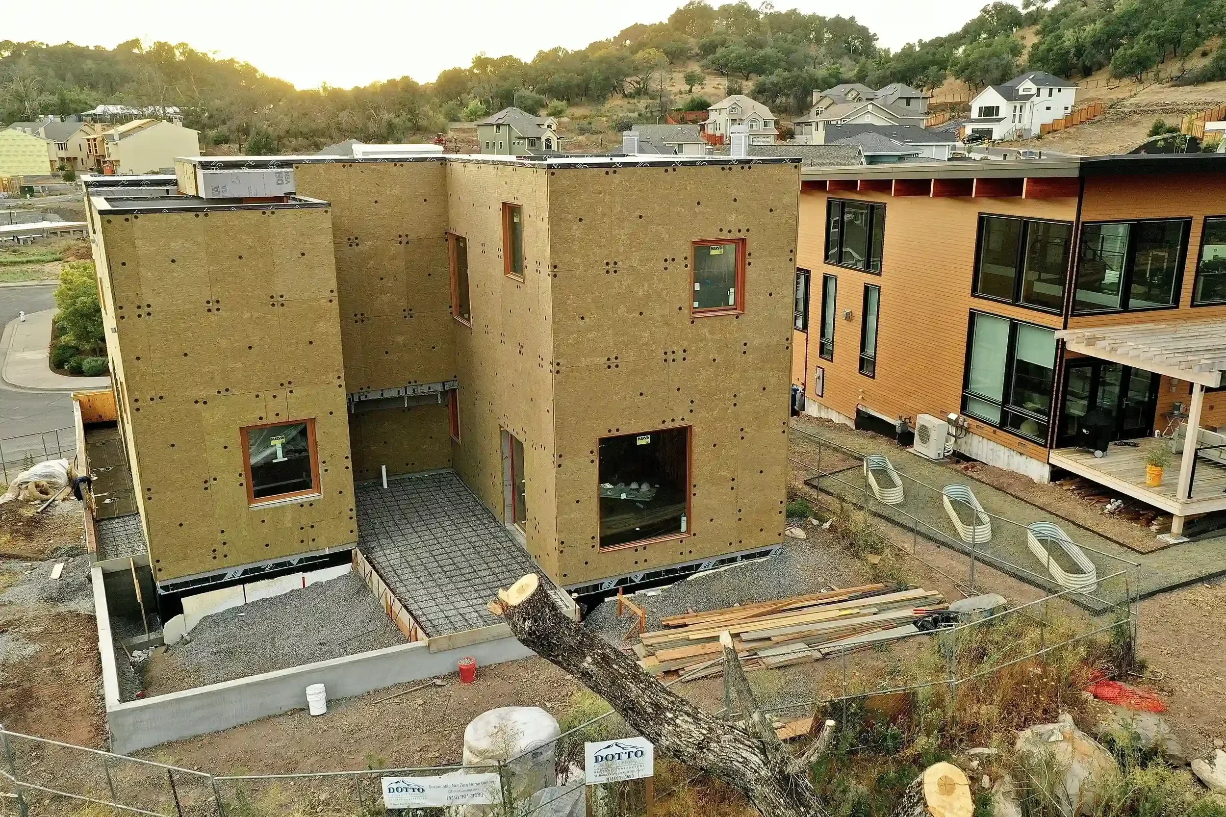 a-small-building-with-a-large-brick-wall.webp