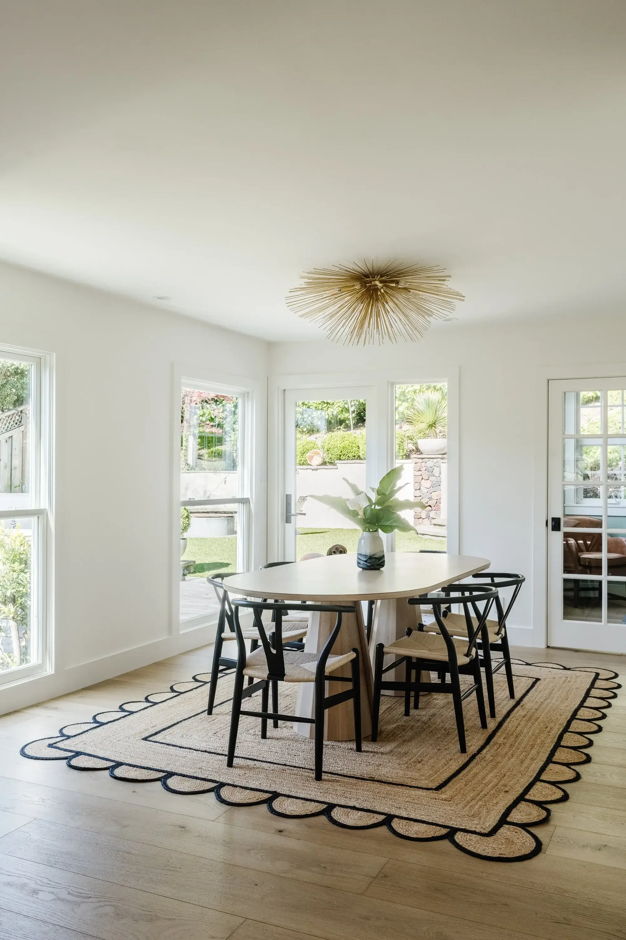 A dining room table with a large white table cloth