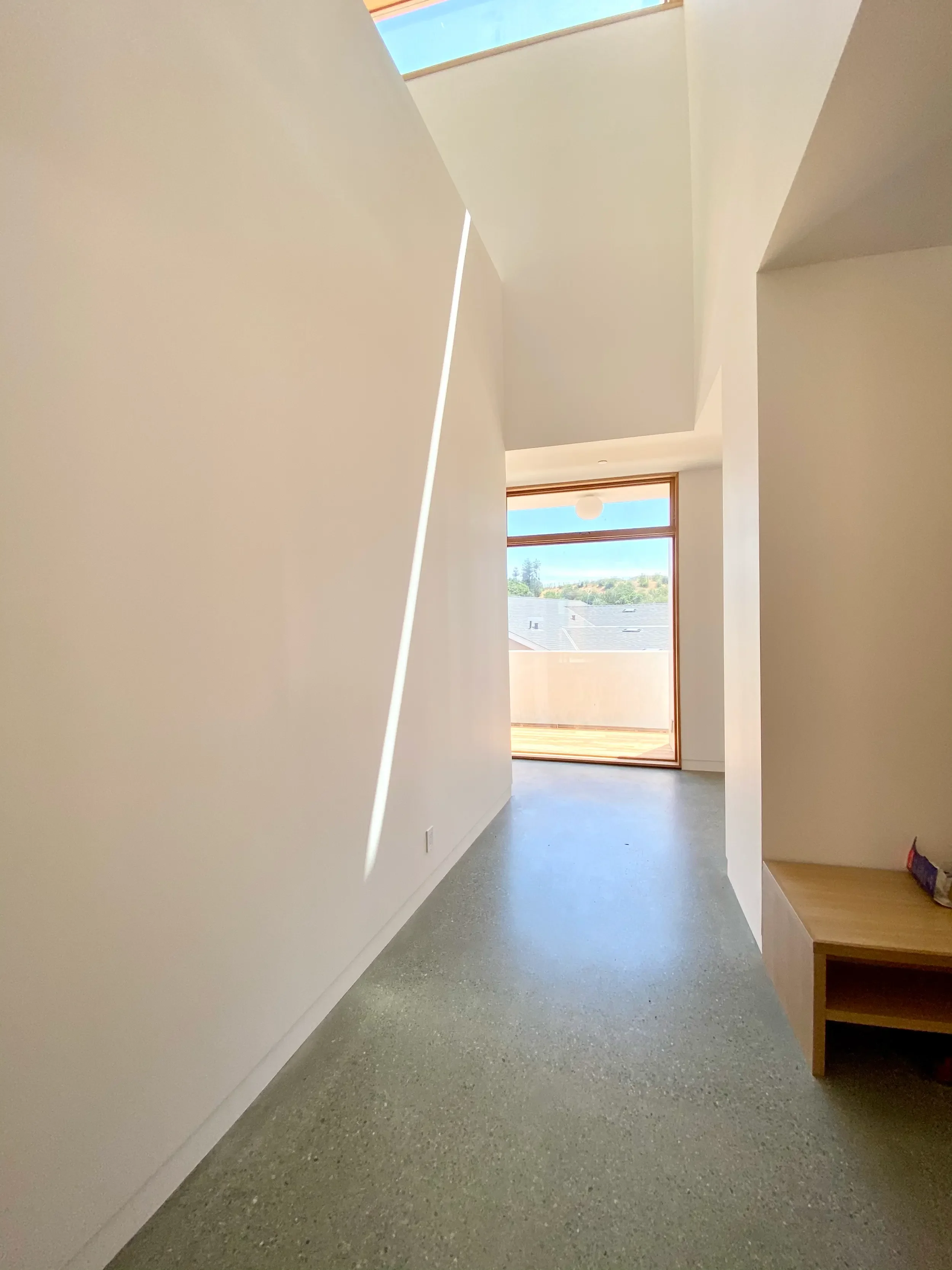 a-room-with-a-white-wall-and-a-blue-floor