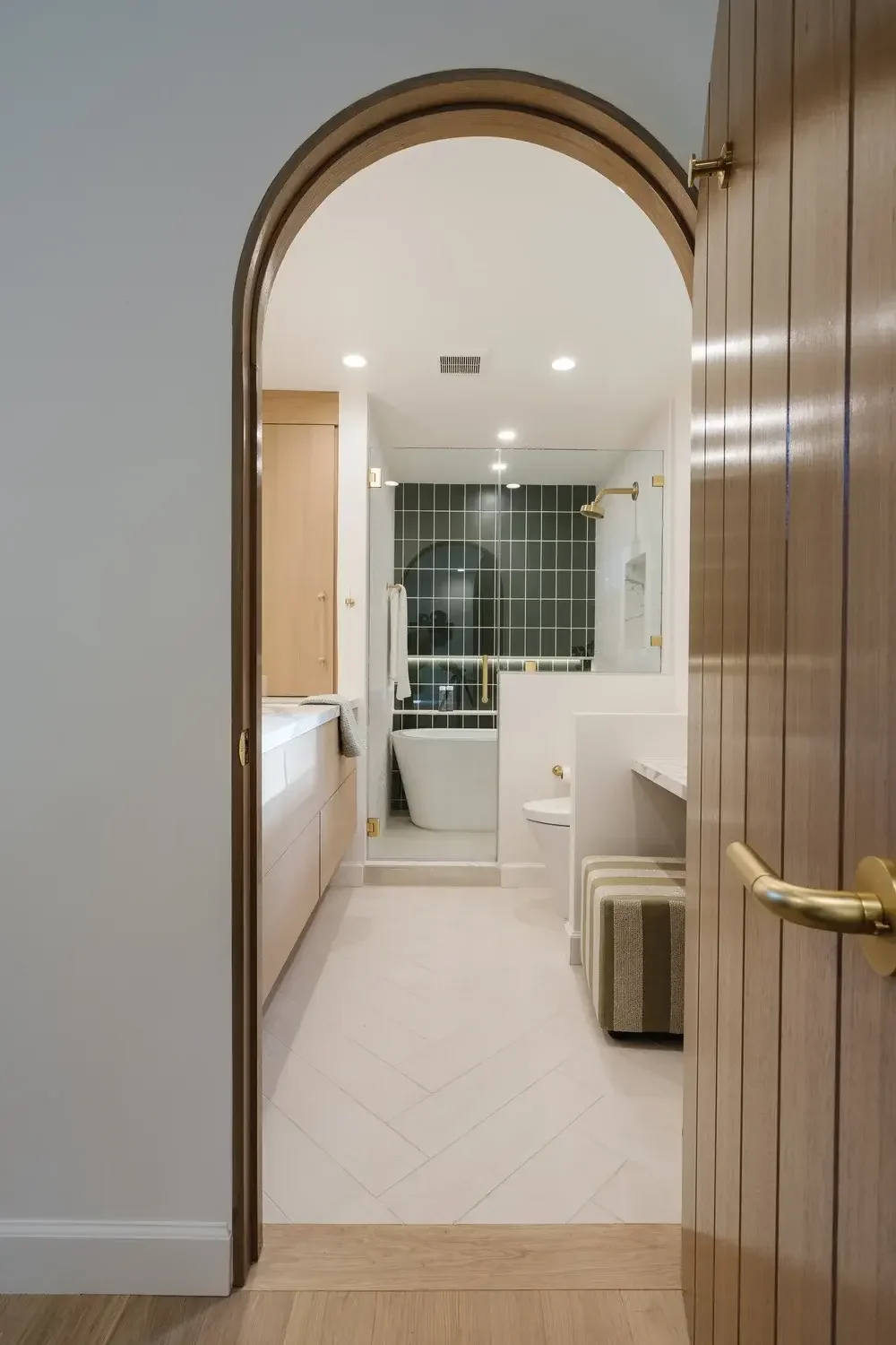 A bathroom with a white sink and a white toilet