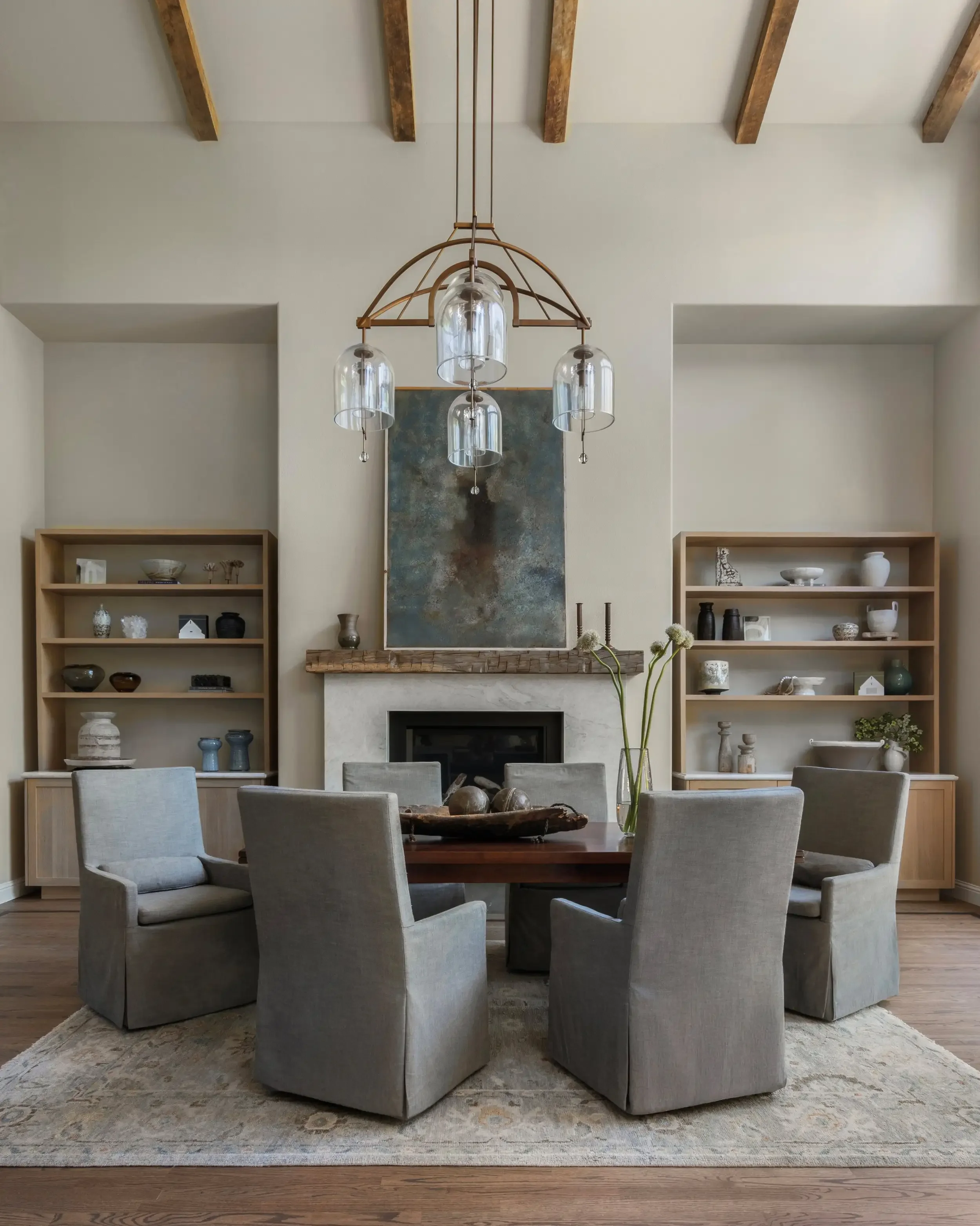 a-living-room-with-a-fireplace-and-a-table.webp
