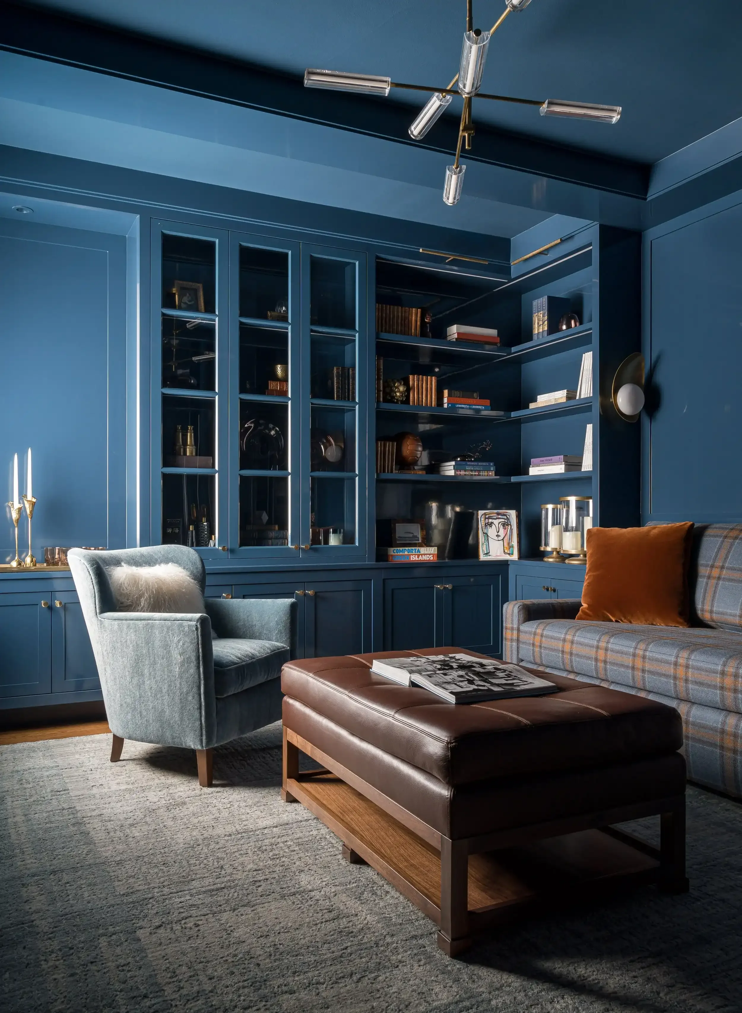 a-living-room-with-a-couch-chair-and-a-tv.webp
