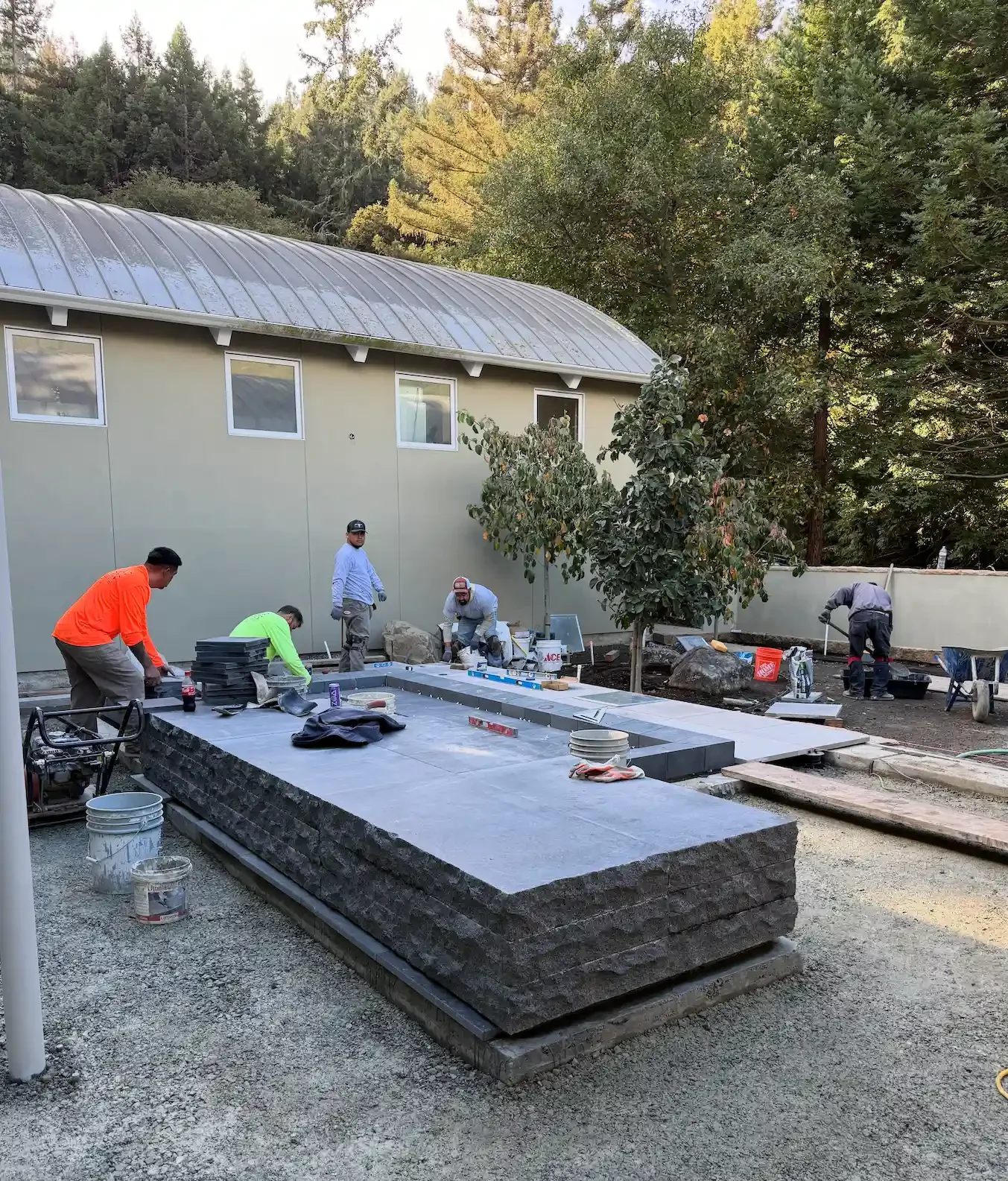 a-man-is-fixing-a-concrete-wall-on-a-building