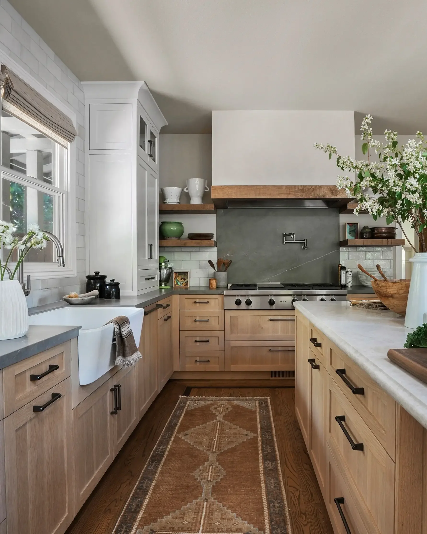 a-kitchen-with-a-sink-stove-and-a-counter-top.webp