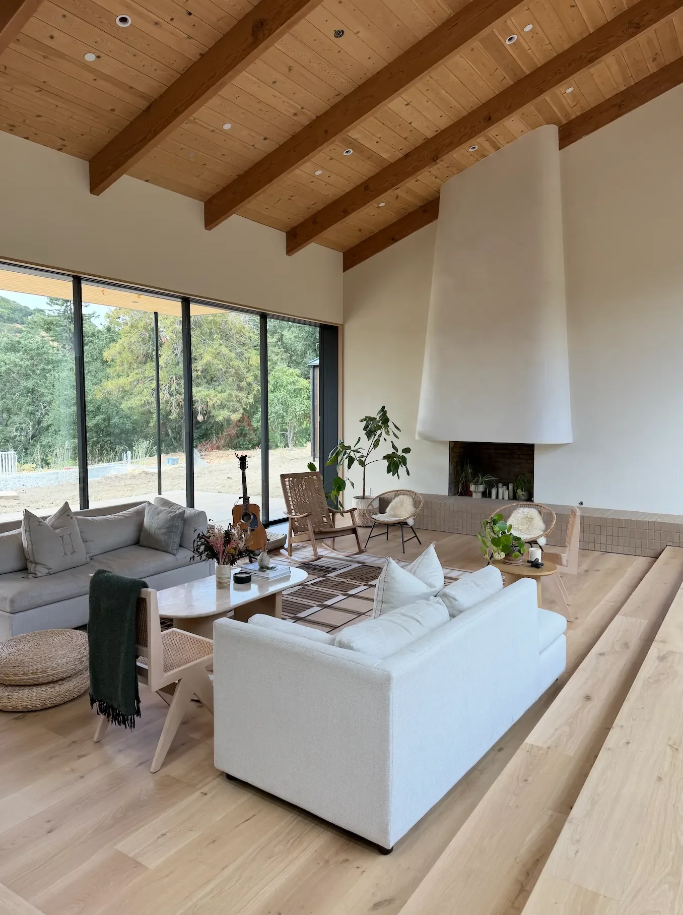 a-living-room-with-a-large-white-couch-and-a-large-window