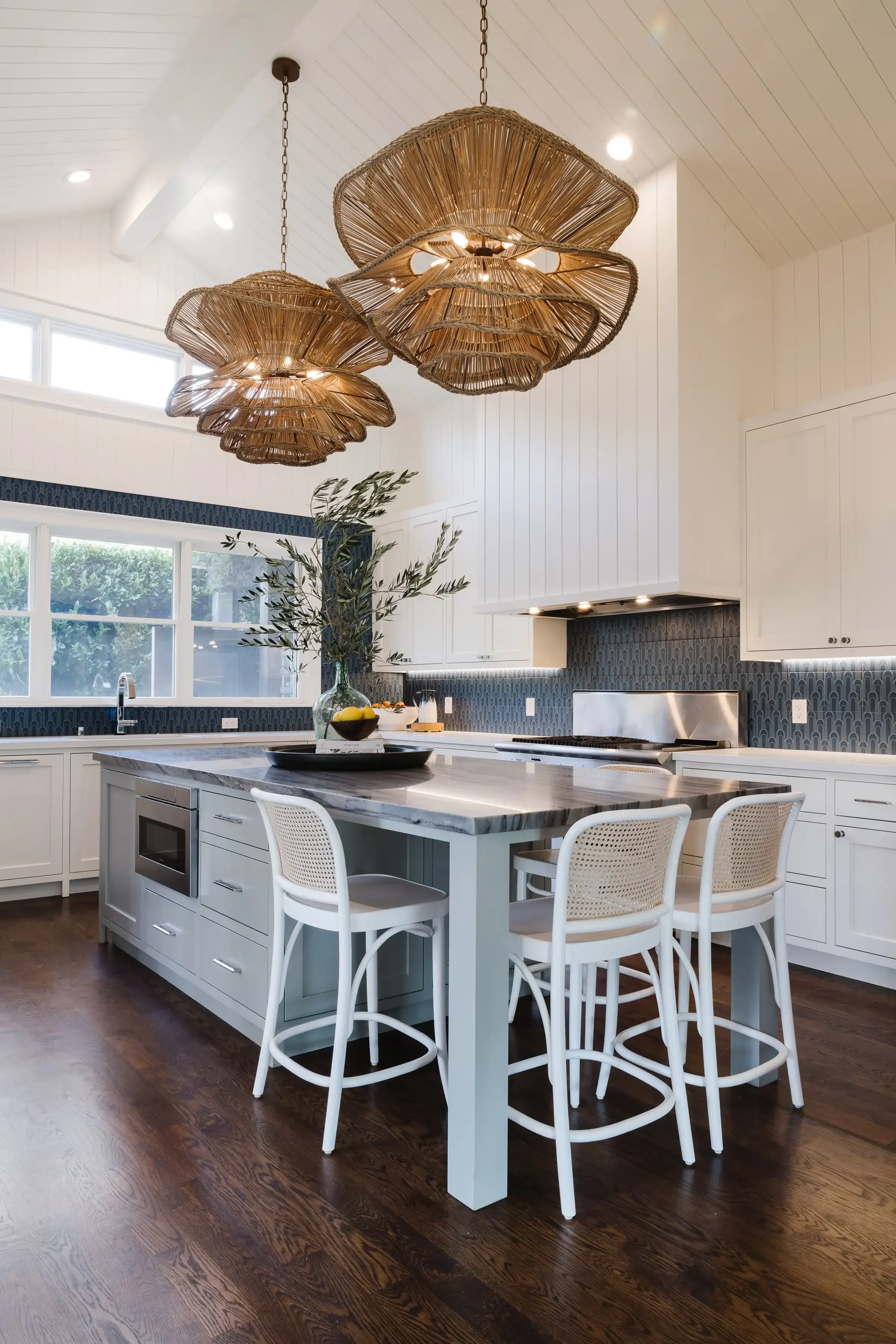 a-kitchen-with-a-large-island-and-a-large-counter-top.webp