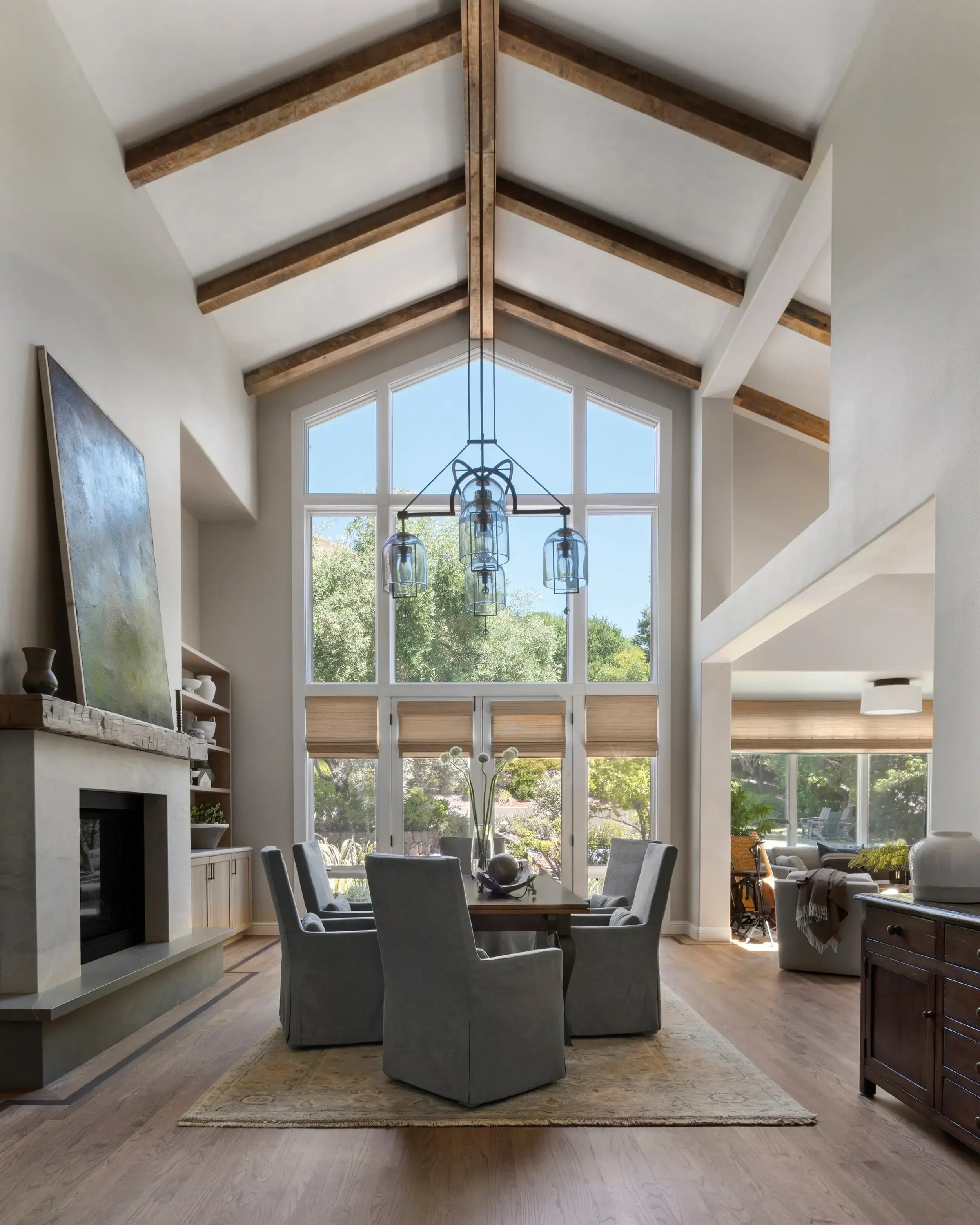 a-large-room-with-a-large-window-and-a-large-couch.webp