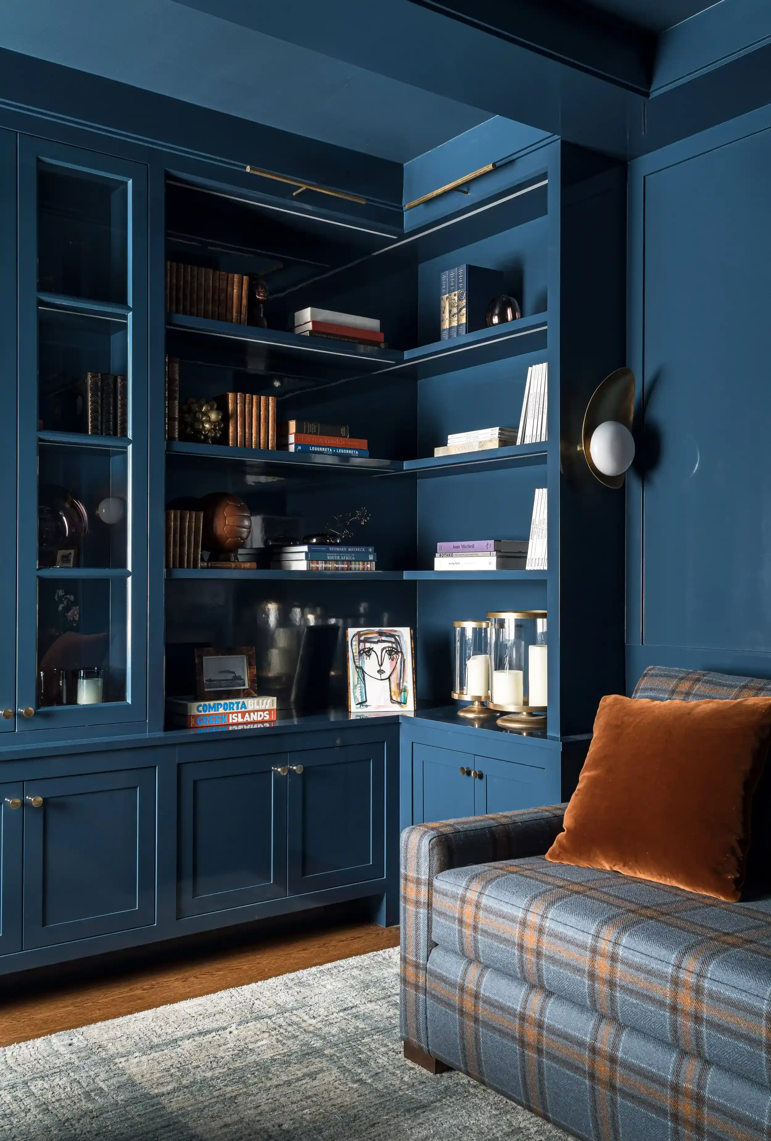 a-room-with-a-bed-a-shelf-and-a-tv.webp