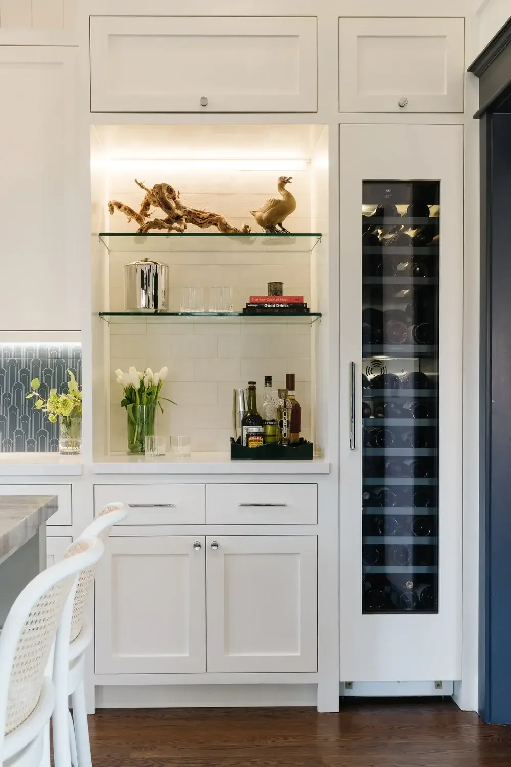 A white refrigerator and a white sink in a room