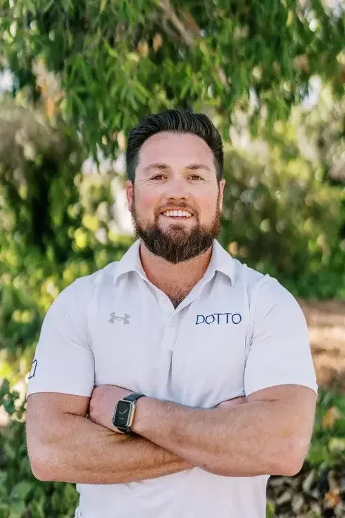 A man in a blue shirt and a tie