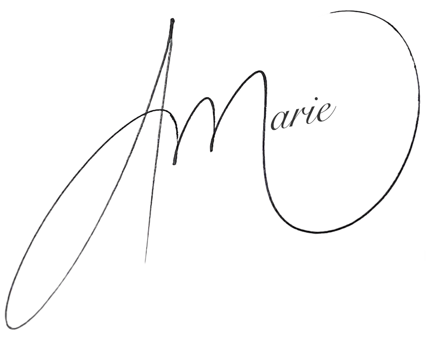 Stylized signature of the name 'Marie' written in black on a transparent background.