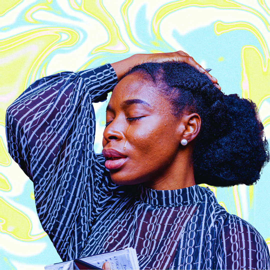 A black person in a black and white shirt closes their eyes and rests one hand on their head. A tear is streaming down their cheek. They are pictured in front of a wavy abstrack green, white, and blue background.