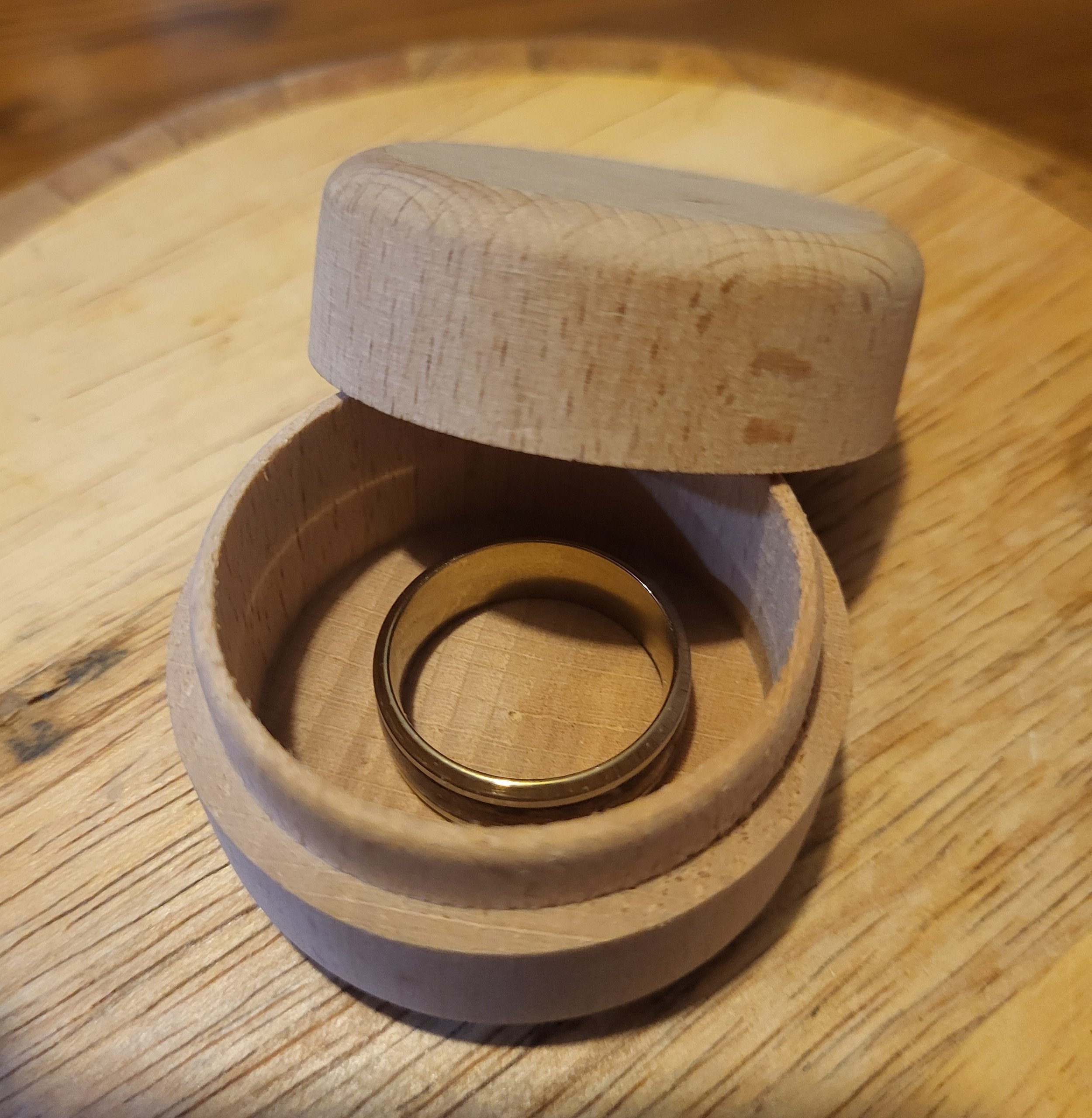 Round wooden ring box (Rings not included).