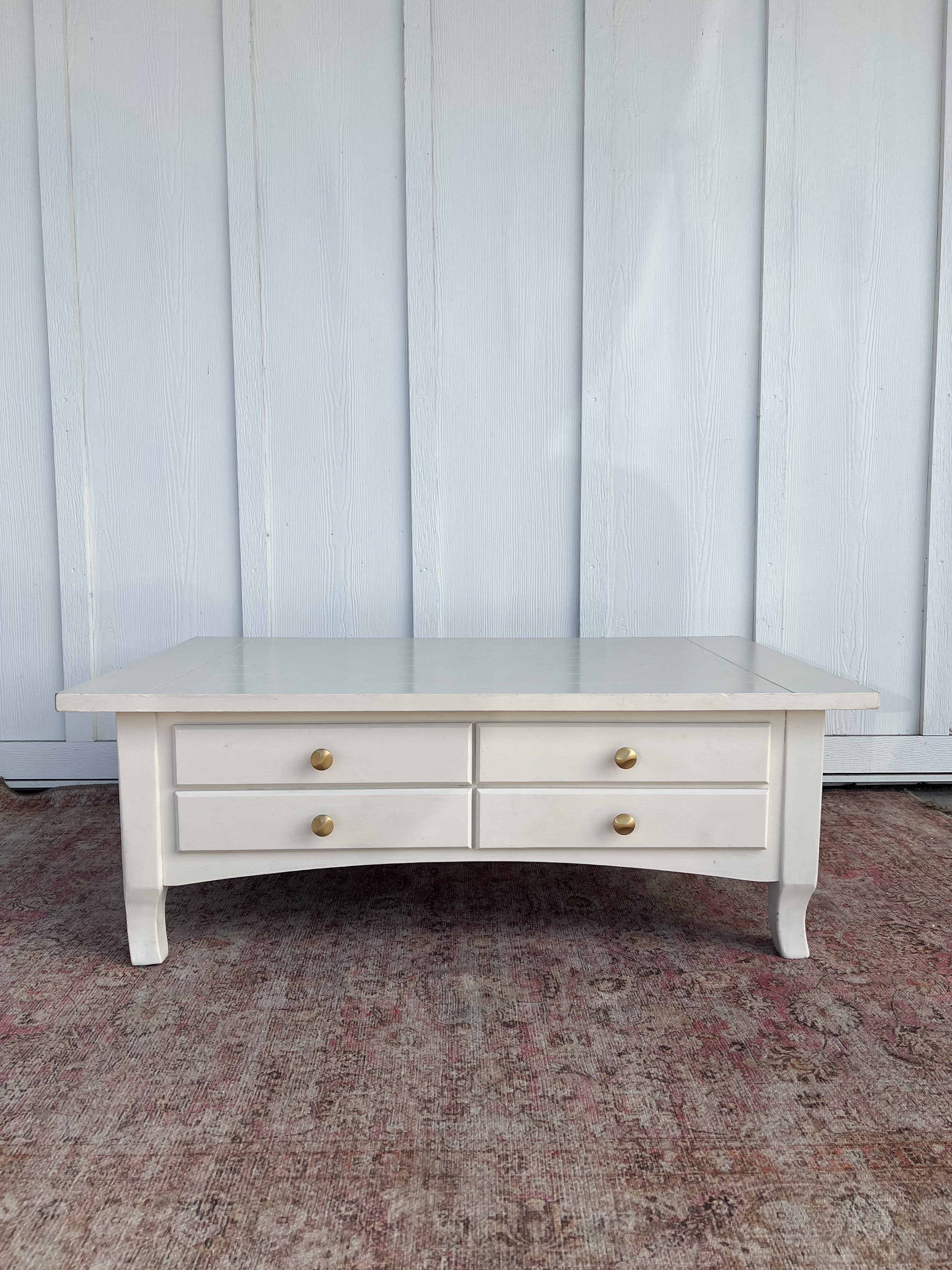 White Wood Coffee Table
Measures approximately: 16” Width x 45” Length x 27” Tall