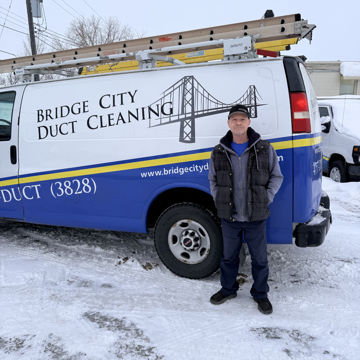 Dave smiling in front of the Bridge City Van