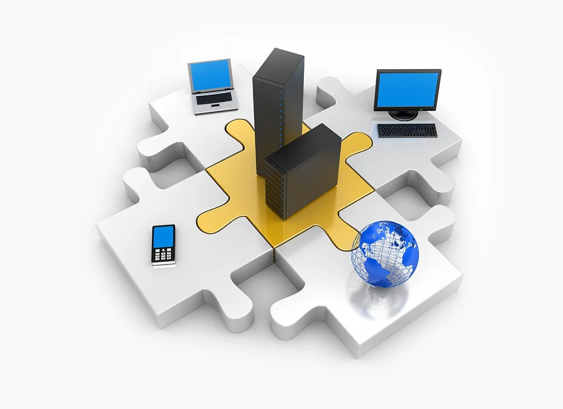 A digital illustration of a puzzle piece with a server, laptop, monitor, cell phone, and globe on it, symbolizing technology and global connectivity.