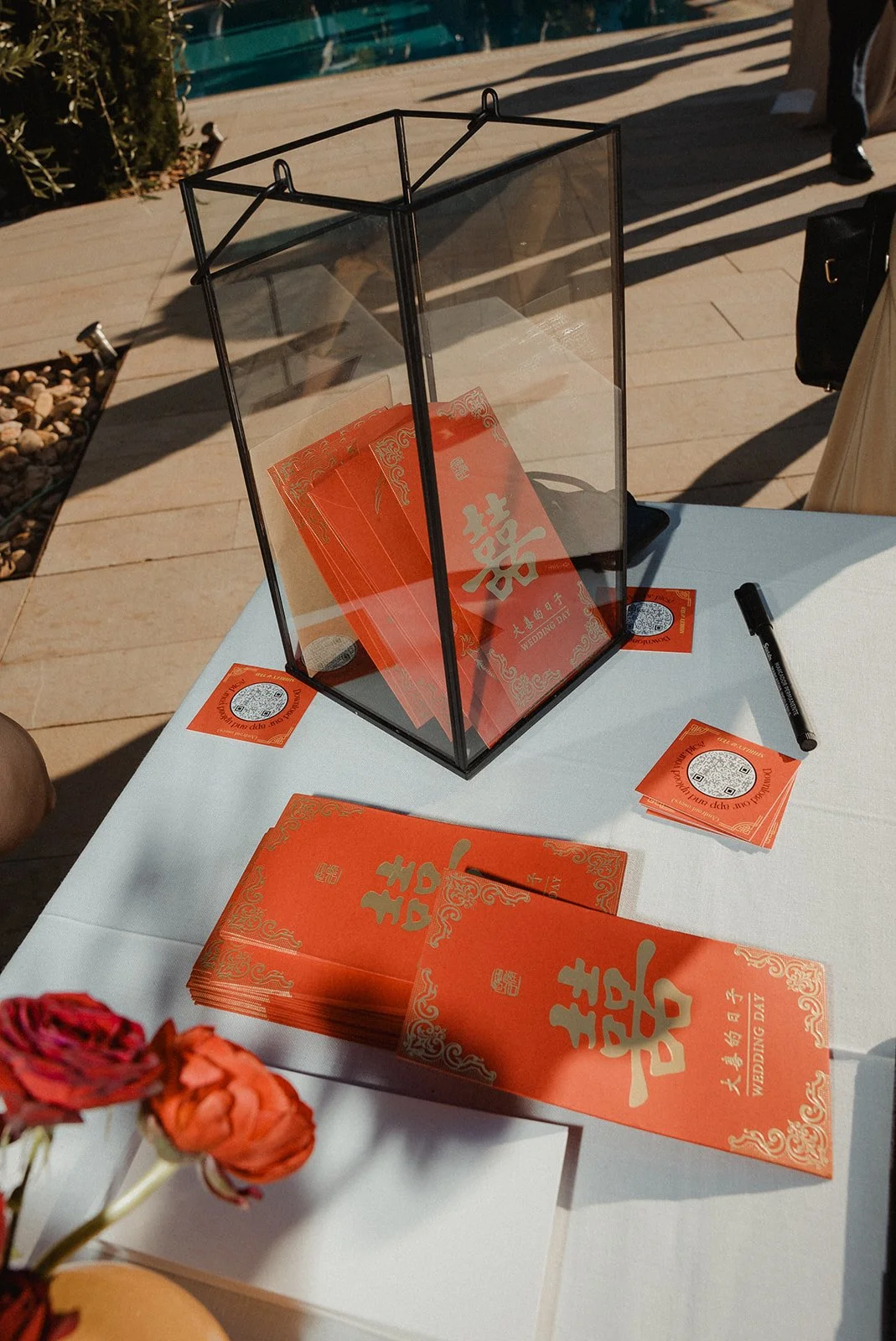 Red Chinese lucky envelopes with guest well wishes, Ibiza wedding tradition