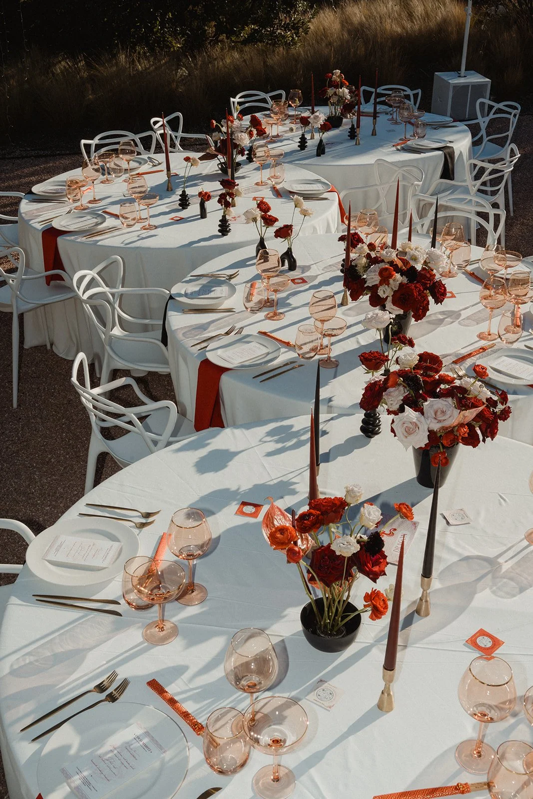 Vibrant reception styling with red and pink florals by Aurea, Ca Na Xica Ibiz