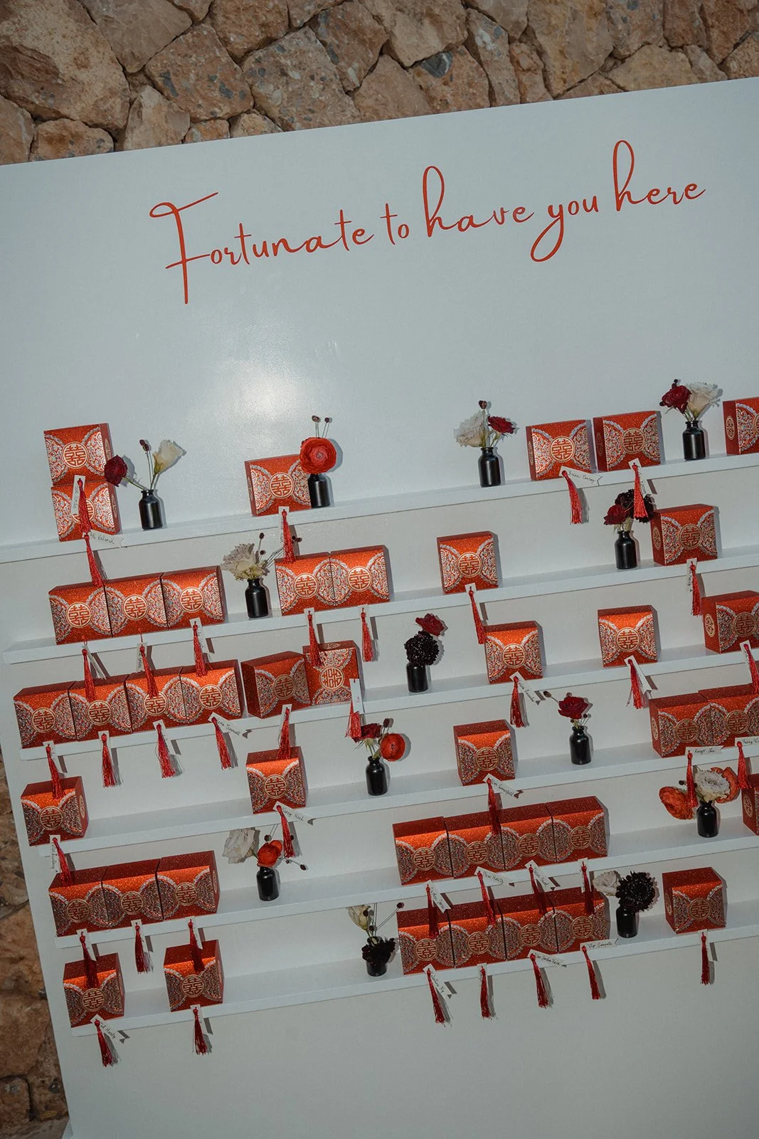 Custom fortune cookie table plan display at Chinese fusion wedding