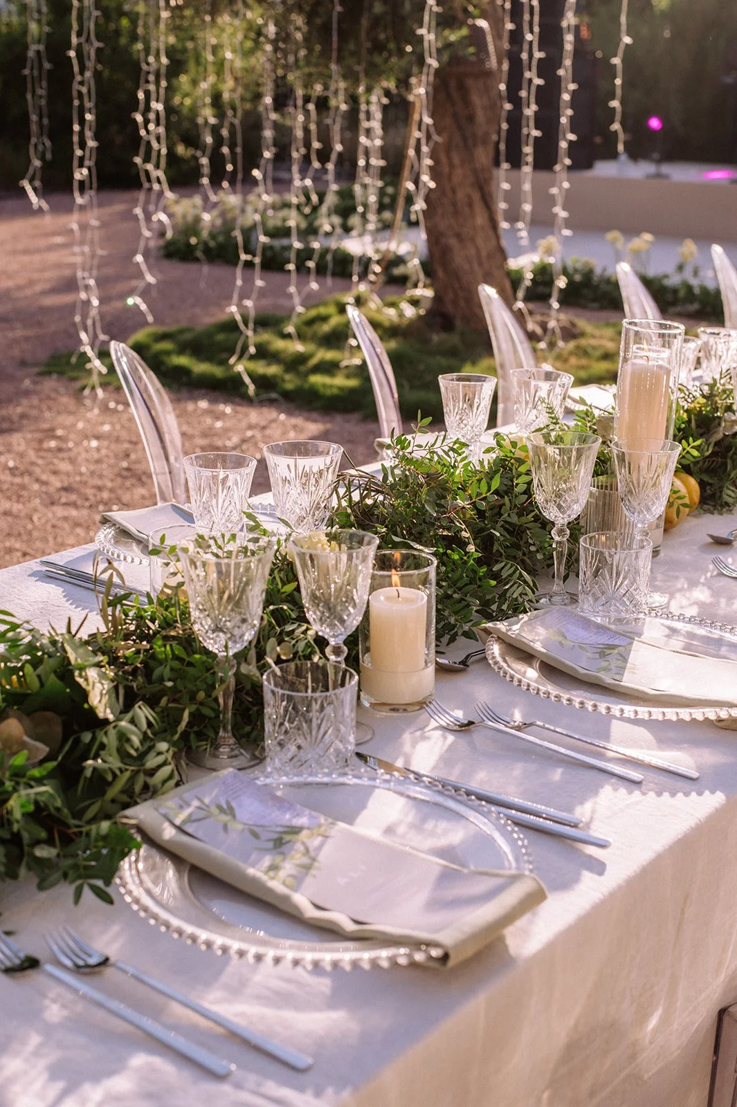 Ibiza wedding reception , stylish tables with festoon lighting and olive trees