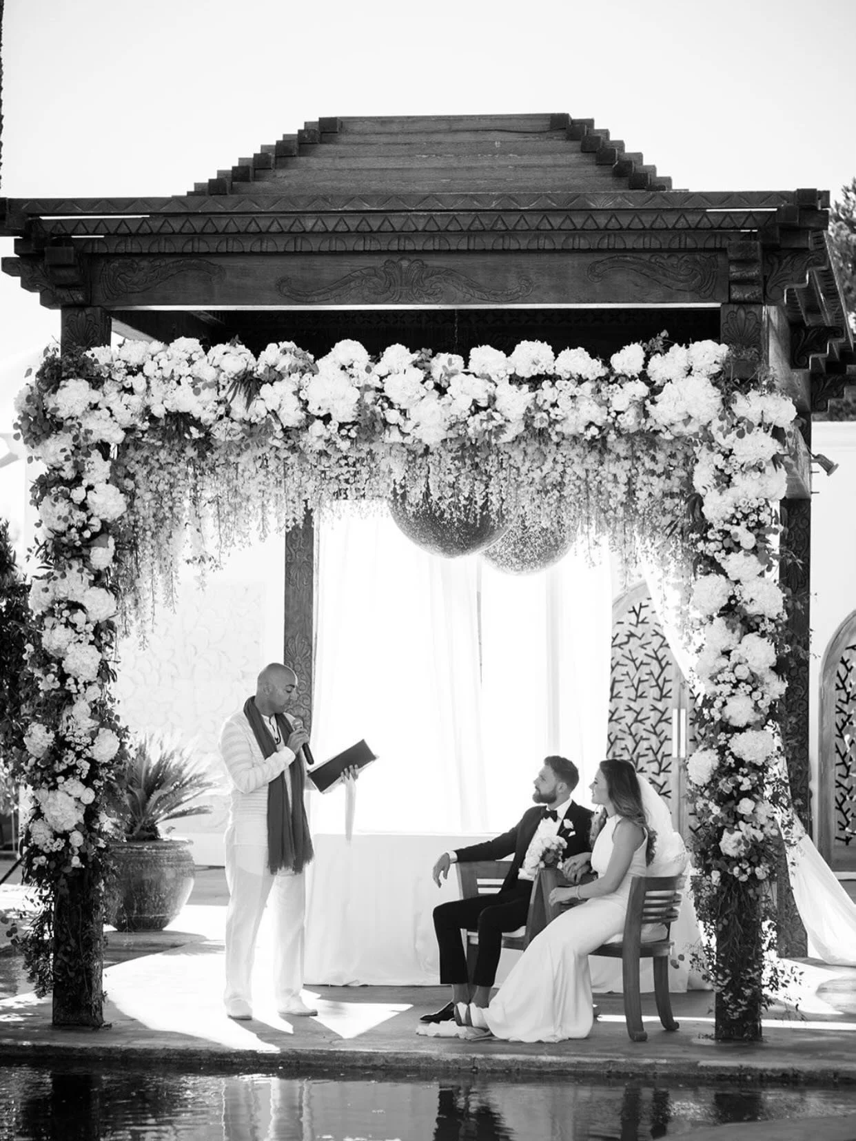 One of Ibiza&rsquo;s most iconic boutique hotels @atzaro_hotel 
A ceremony amongst the orange groves an by the water capture by @gypsywestwoodphotography 
Cascading flowers in shades of white, golden hour light, and two people who have been visualizi