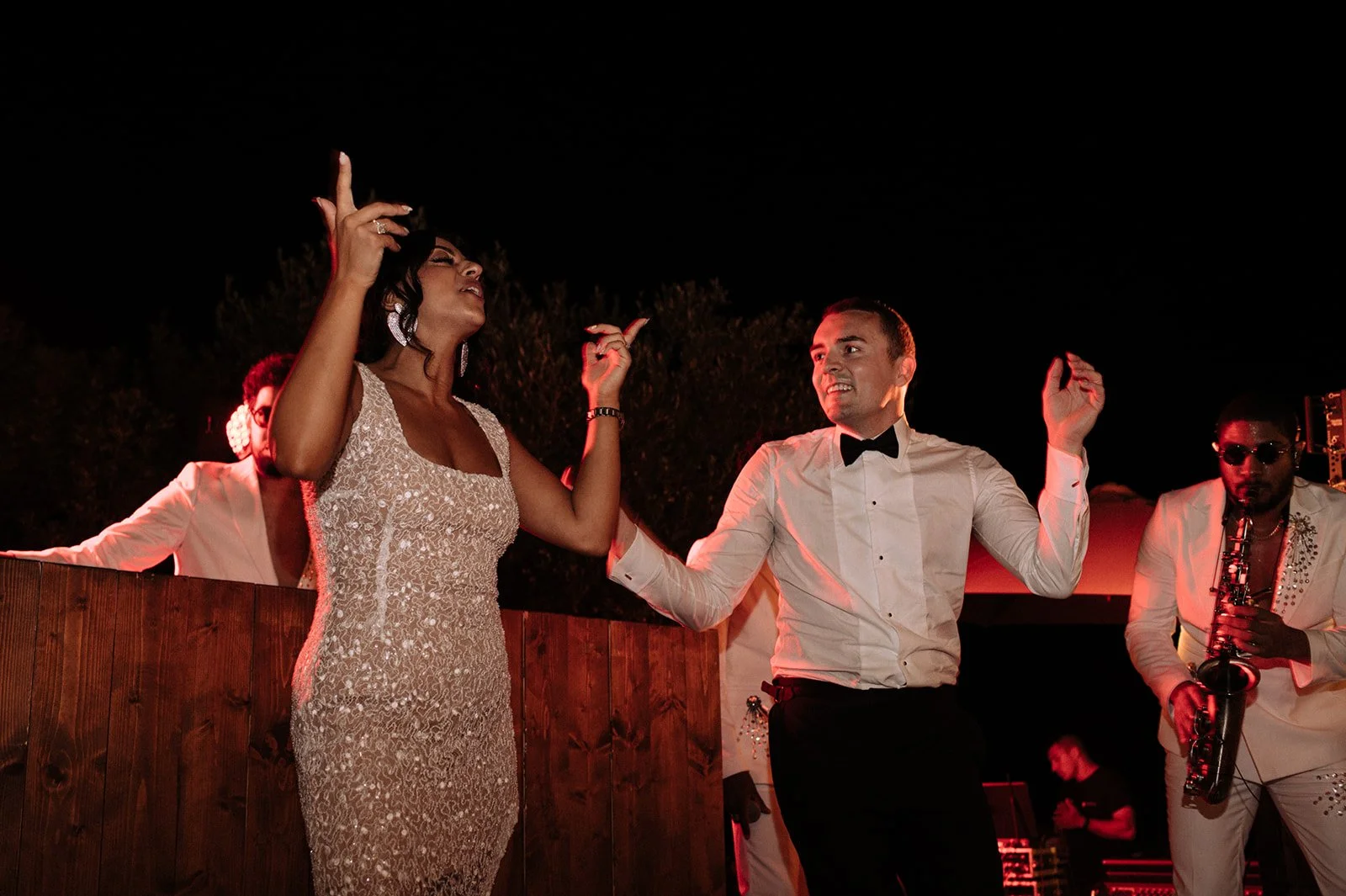 Couple dancing on stage at luxury Ibiza wedding reception