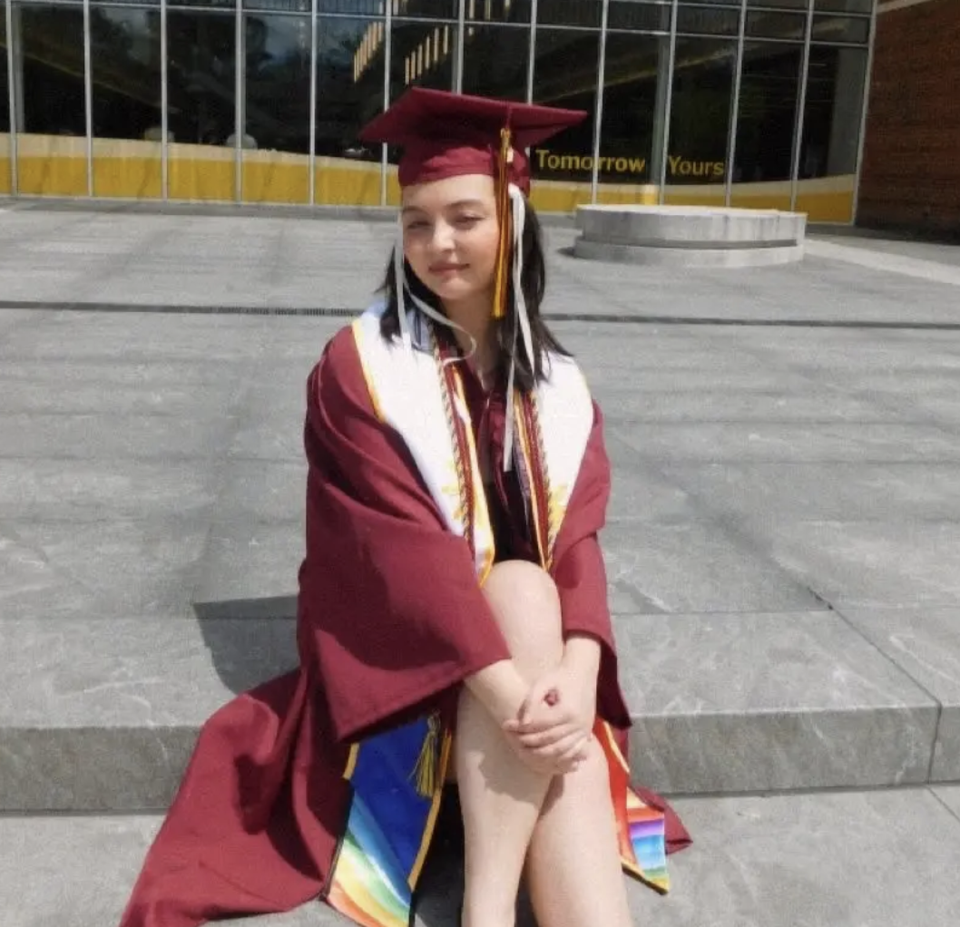 Student wearing red graduation robes