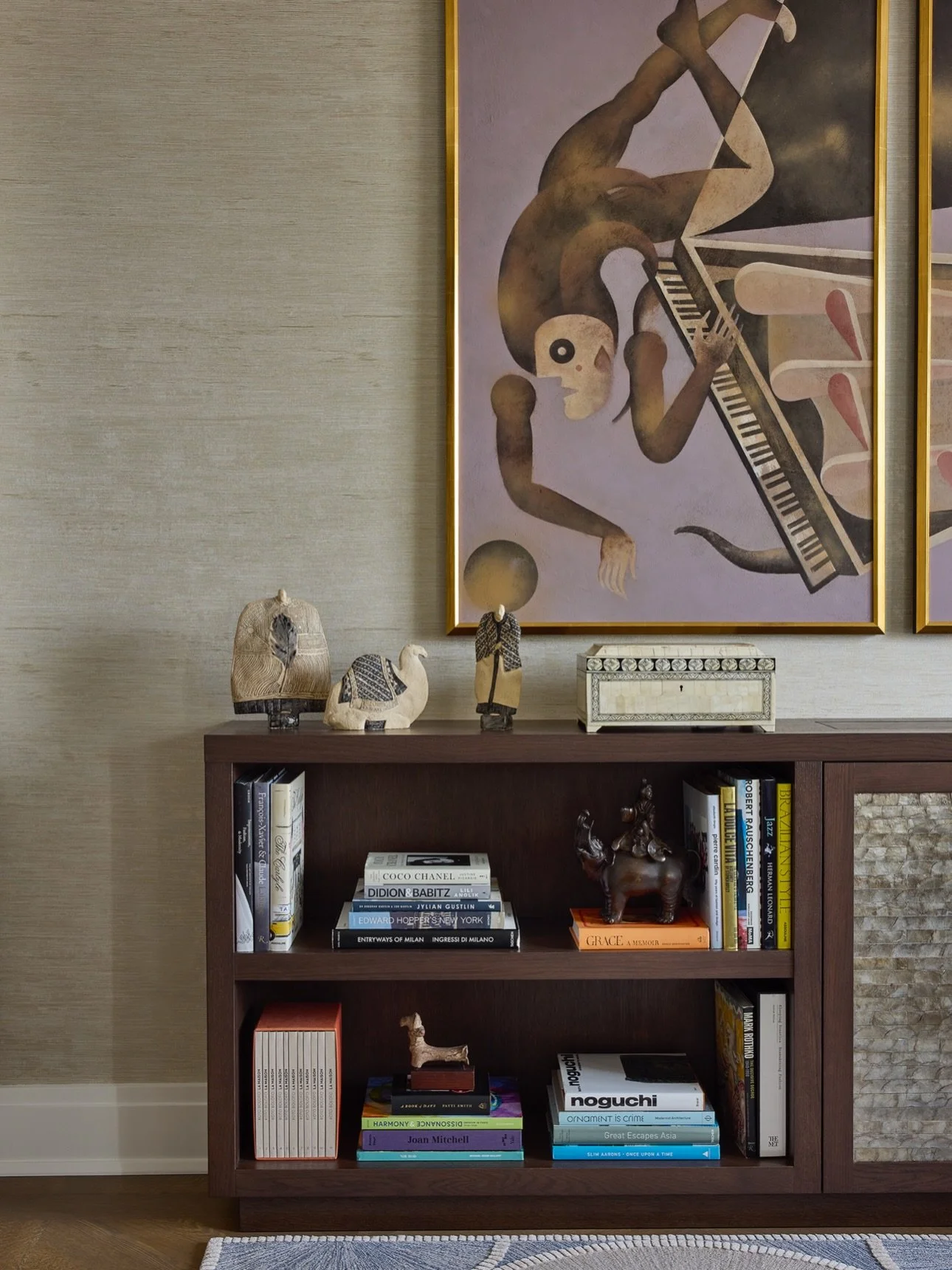 A moment at the Belnord. A bespoke console by us anchors the drawing room, discreetly housing the TV, French Japonisme ceramic objets and a commissioned whimsical @pieropaladini triptych complete the composition. 

#nycinteriordesigner #bespokeinteri