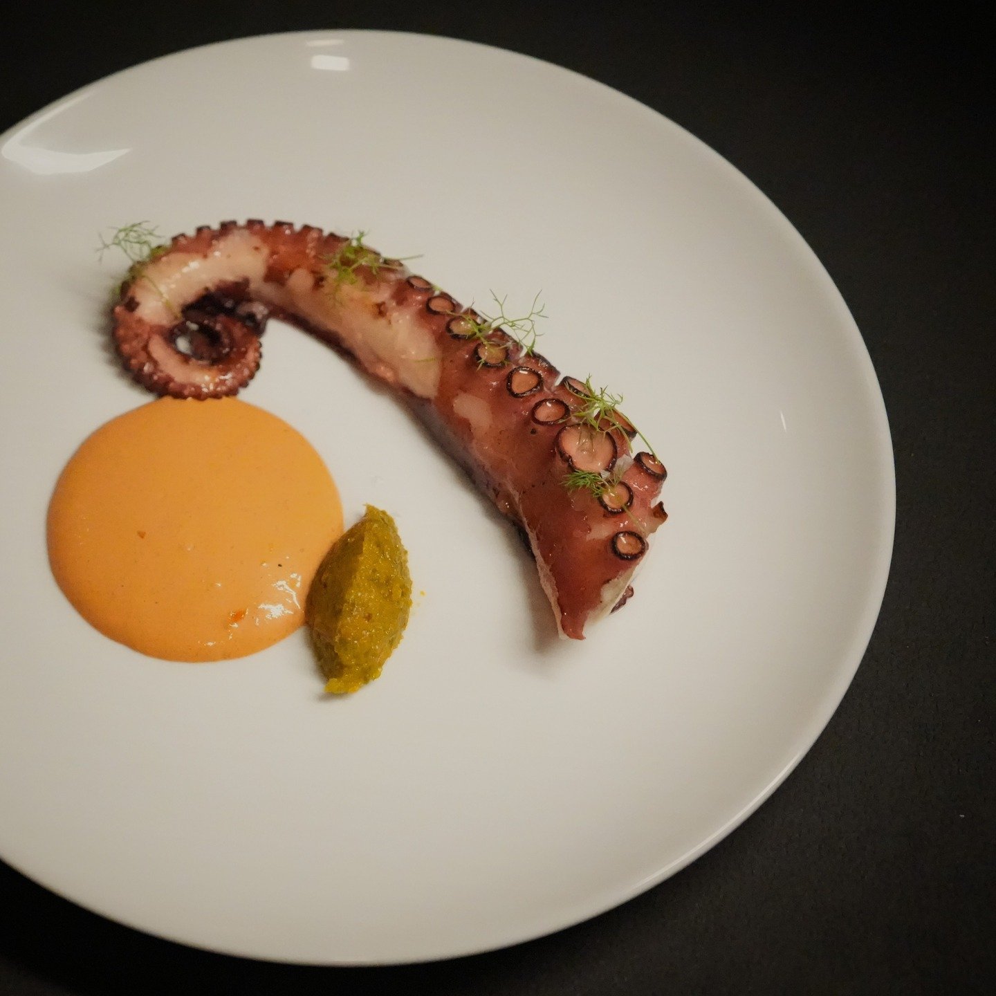 Grilled Spanish octopus leg. Paired with a zesty orange kosho and a spicy piment&oacute;n emulsion for that smoky, citrusy kick. 

#PenangFoodie #PenangEats #OctopusLovers #WhatToEatPenang #PenangDinnerSpot #SpanishFlavours #SeafoodVibes #SupportLoca