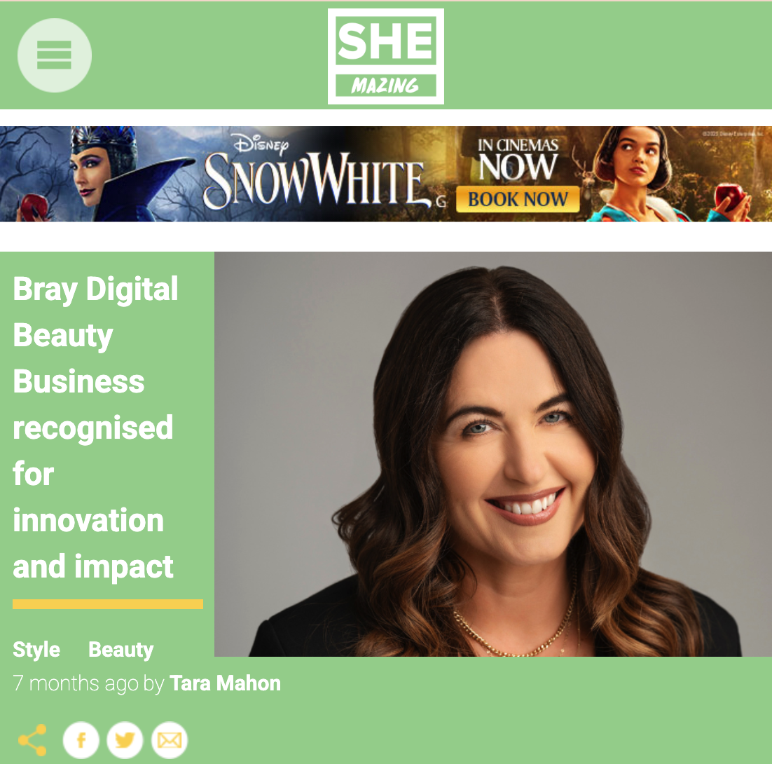 Screenshot of a SHEmazing article featuring a headline about a Bray digital beauty business recognized for innovation. The top banner is an advertisement for Disney's Snow White movie, with a 'Book Now' button. Below is a portrait of a woman with long brown hair. The article's author, Tara Mahon, is credited.