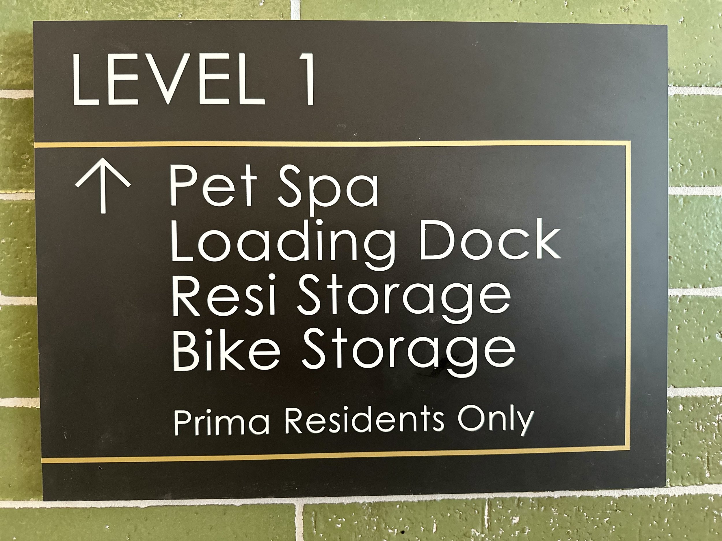 Sign listing facilities on Level 1, including Pet Spa, Loading Dock, Resi Storage, and Bike Storage for Prima Residents Only.