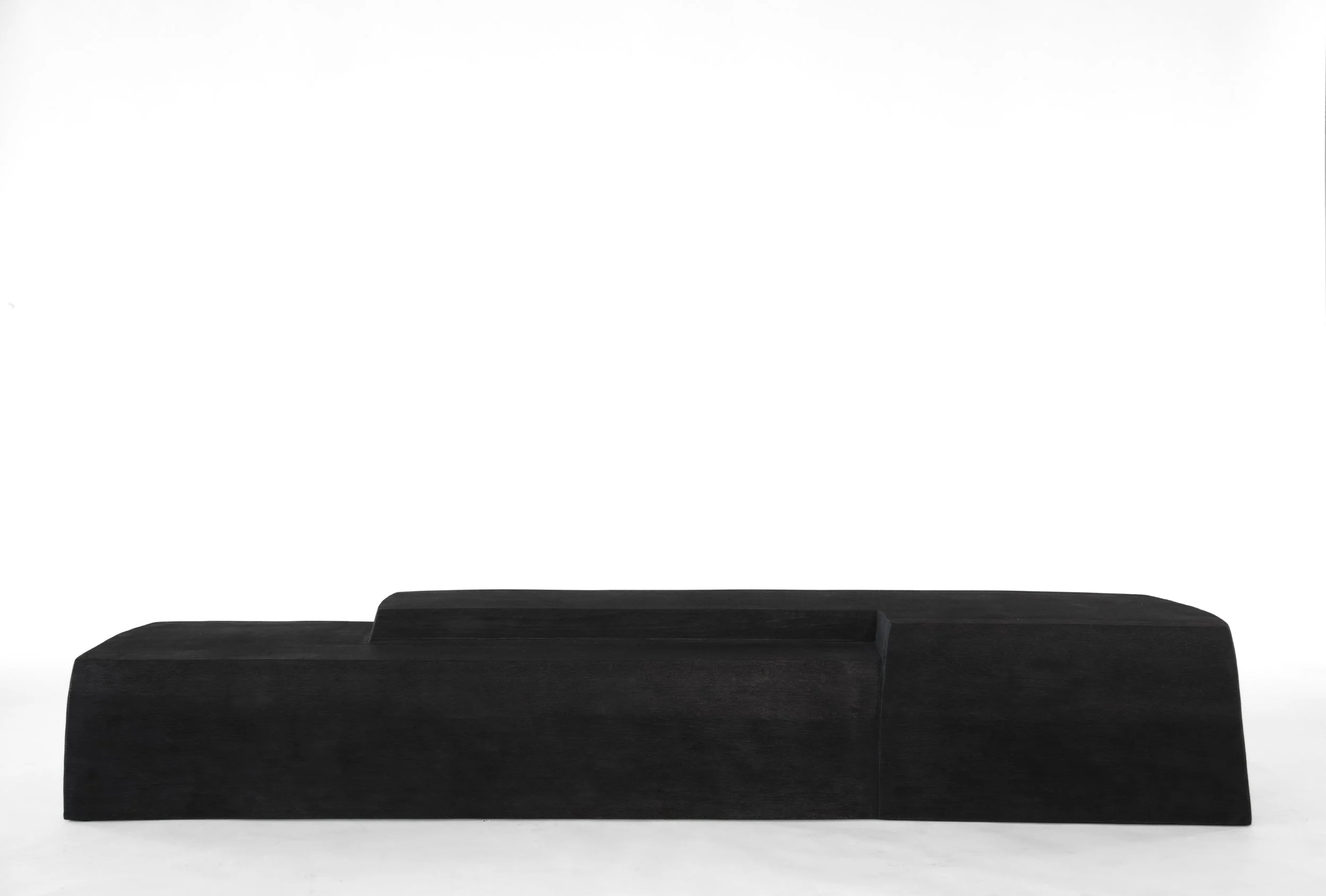 A minimalist black wooden bench with clean lines, set against a plain white background.