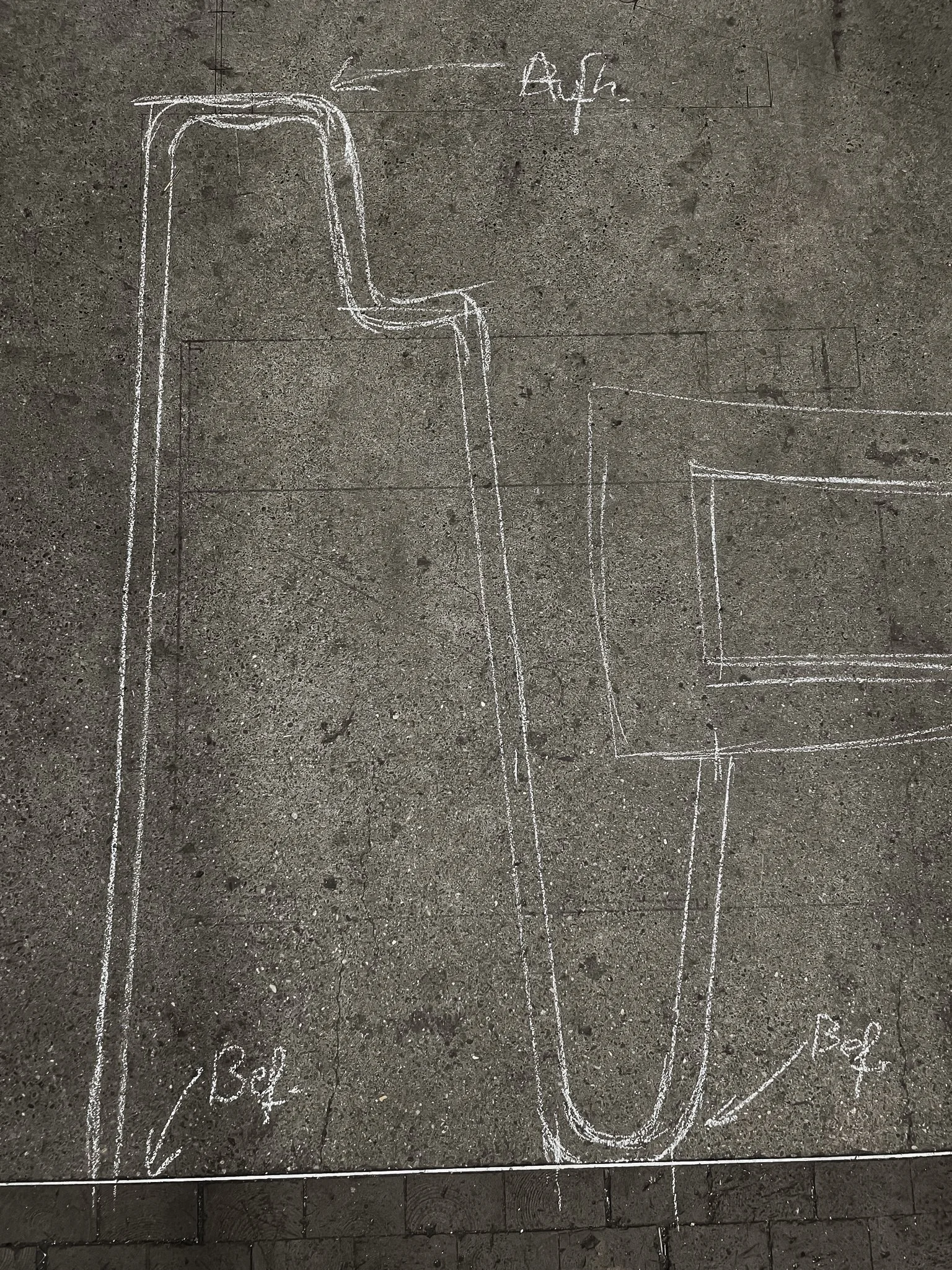 Chalk outline on concrete sidewalk showing the plan for a water slide, with labeled dimensions and sections.