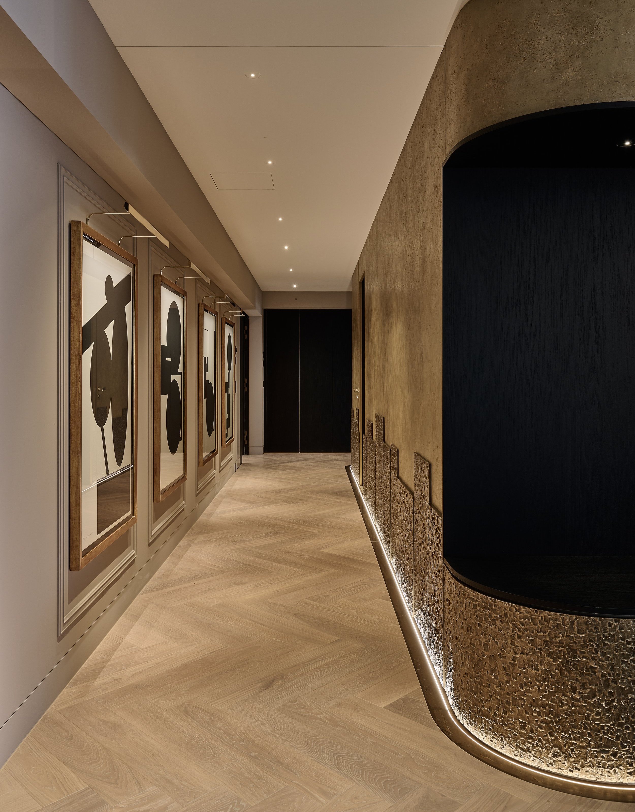 hotel room suite with bronze panels and art