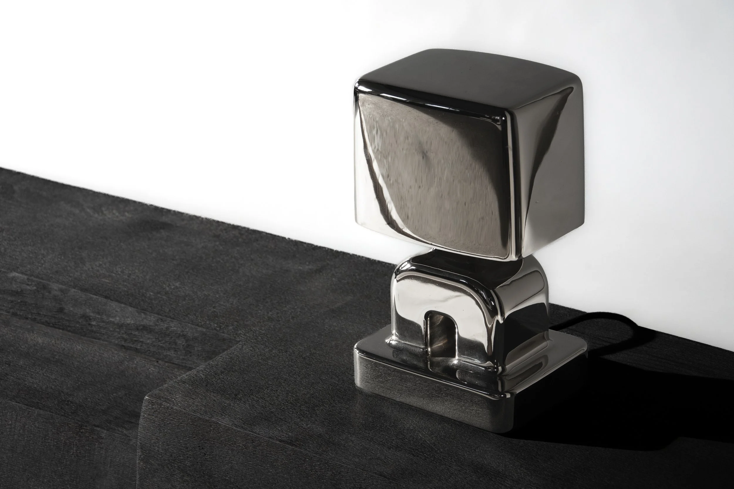 metal map on a black sideboard