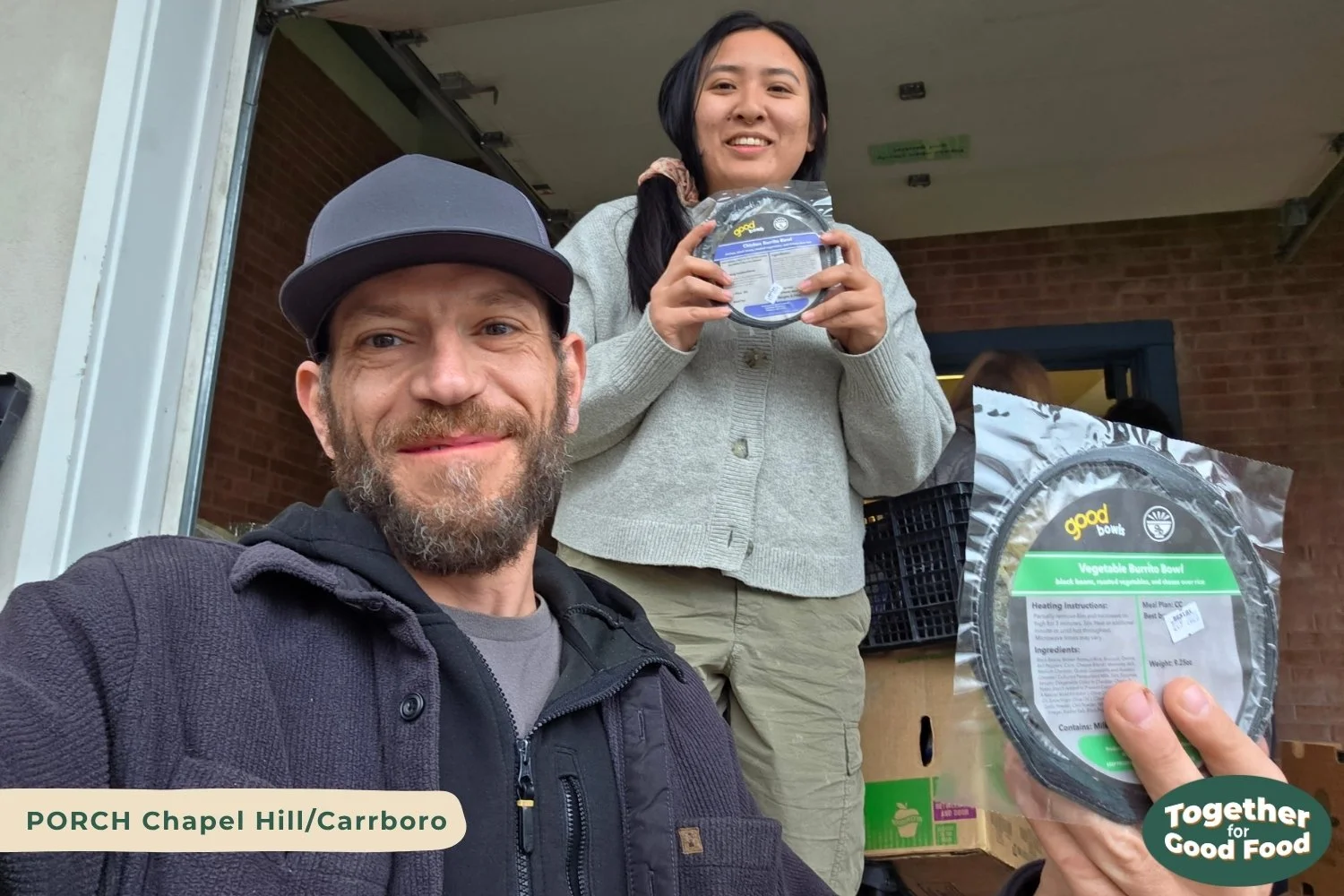 Steve of Equiti Foods and Vera of PORCH Chapel Hill Carrboro both hold a Good Bowl while smiling. 